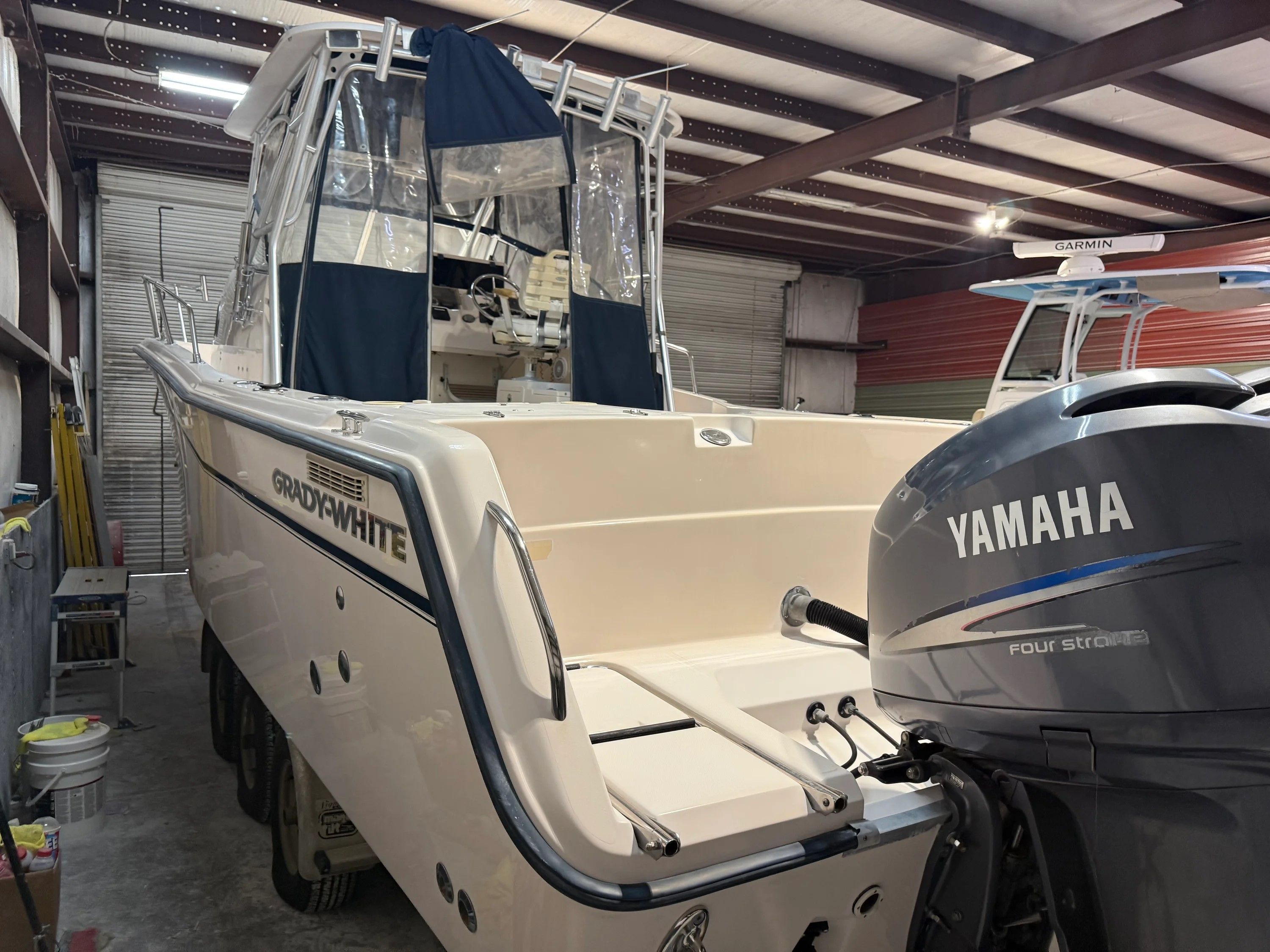 2002 Grady-White Marlin 300 boat in storage facility.