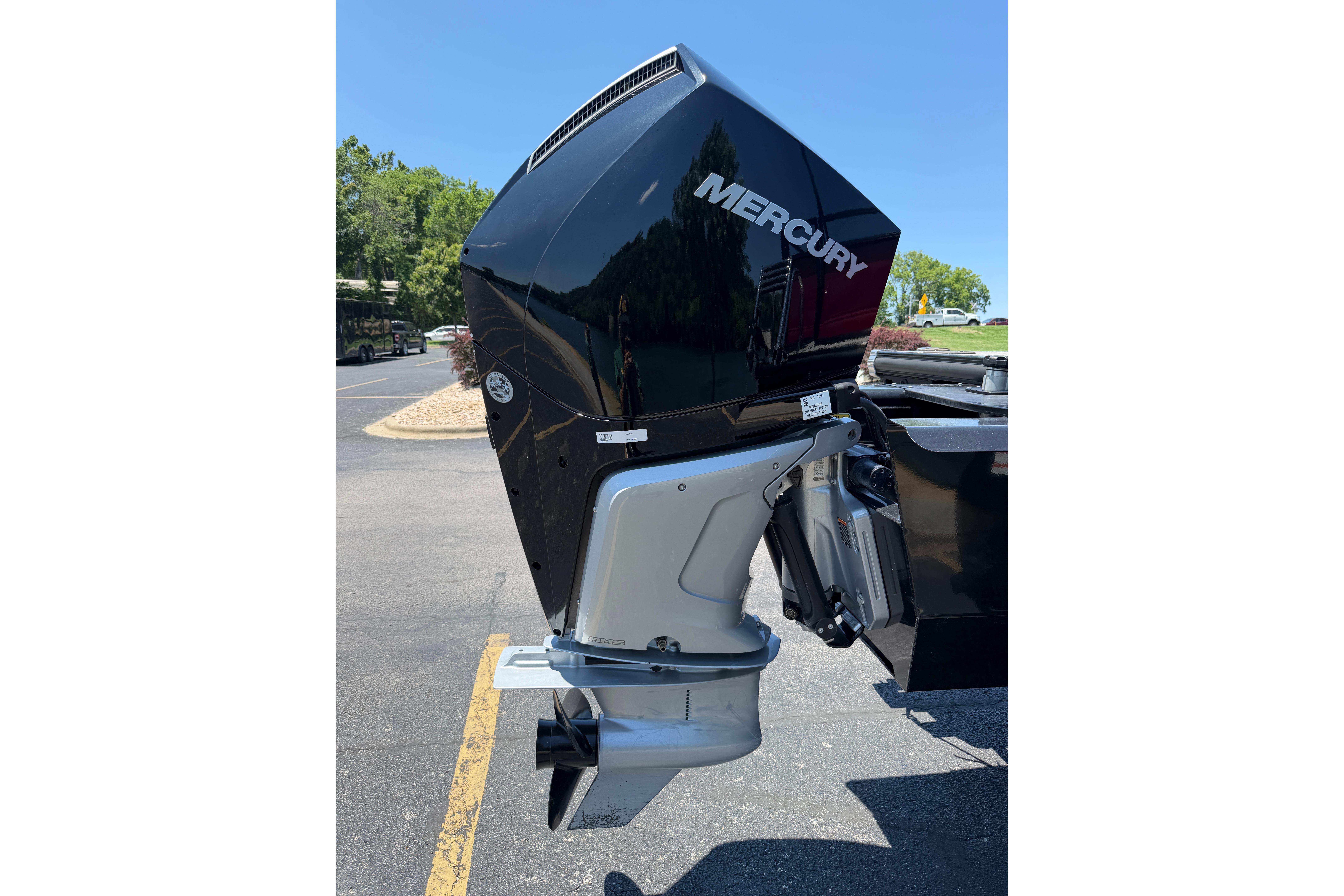 2024 Regency R250DL3 boat with Mercury outboard motor in a sunny outdoor setting.