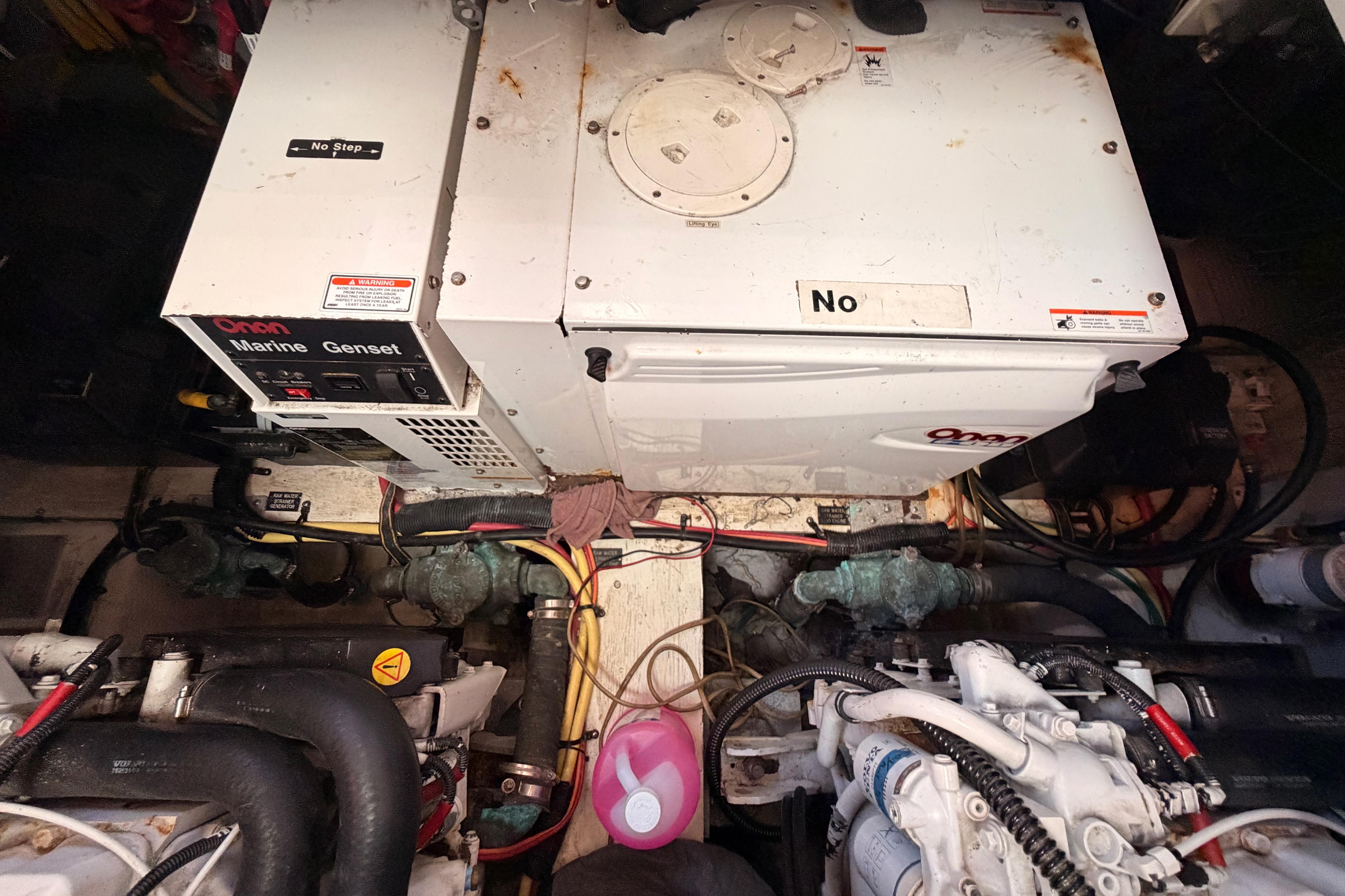 Engine room of 2005 Cruisers Yachts 405 Express Motoryacht with Onan marine generator.