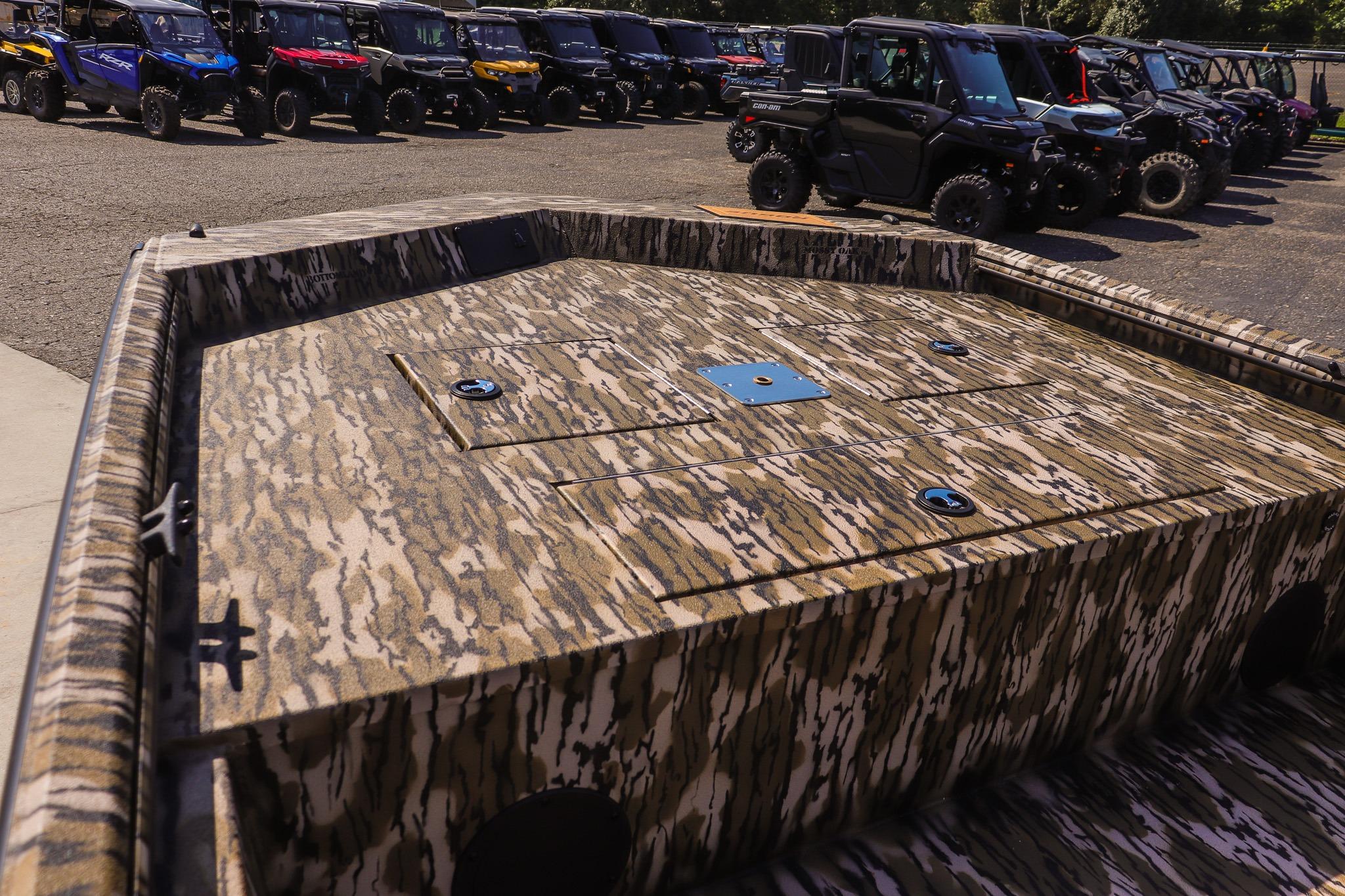 The image shows the deck of an Avid 20 Rogue CC boat with a camouflage pattern.