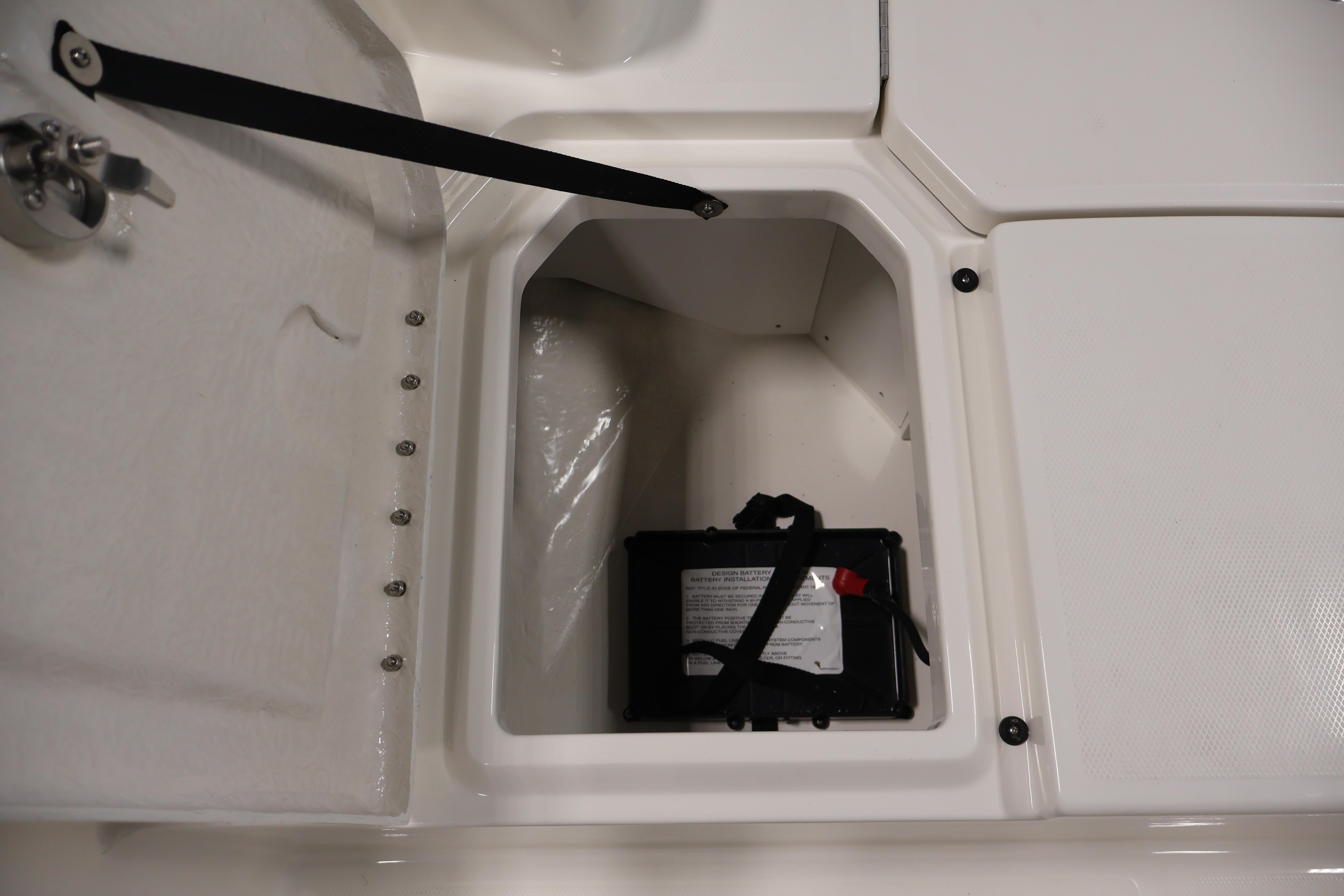 Battery compartment of 2026 Bayliner Trophy T18 boat, featuring secure storage and access.
