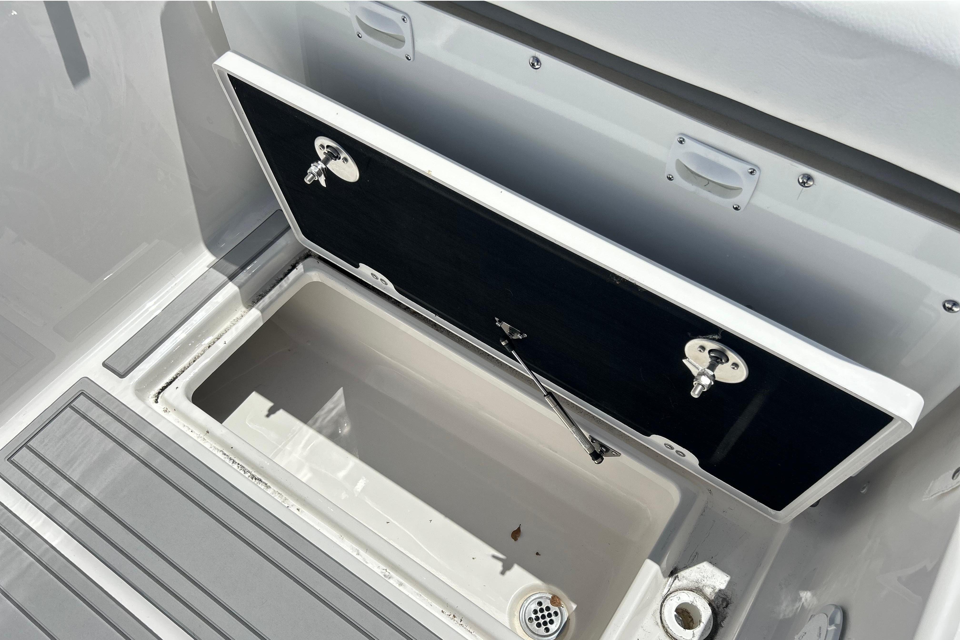 Open storage compartment on a 2026 Sea Fox 288 Traveler boat.