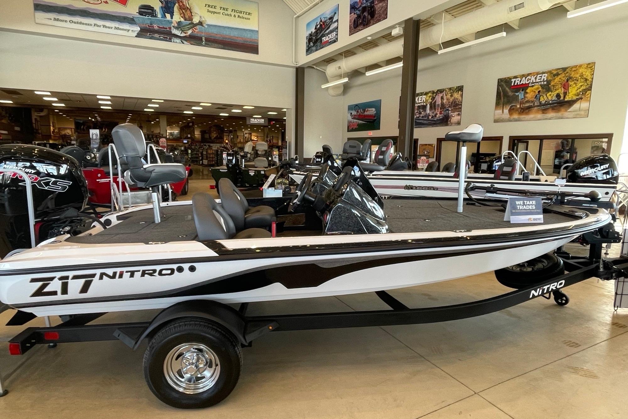 2026 Nitro Z17 boat displayed in showroom, featuring sleek design and modern seating.
