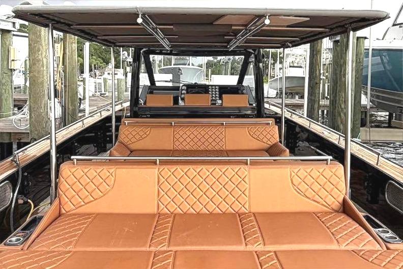 Luxurious 2013 Windy SR52 yacht docked, featuring elegant tan seating and sleek design.