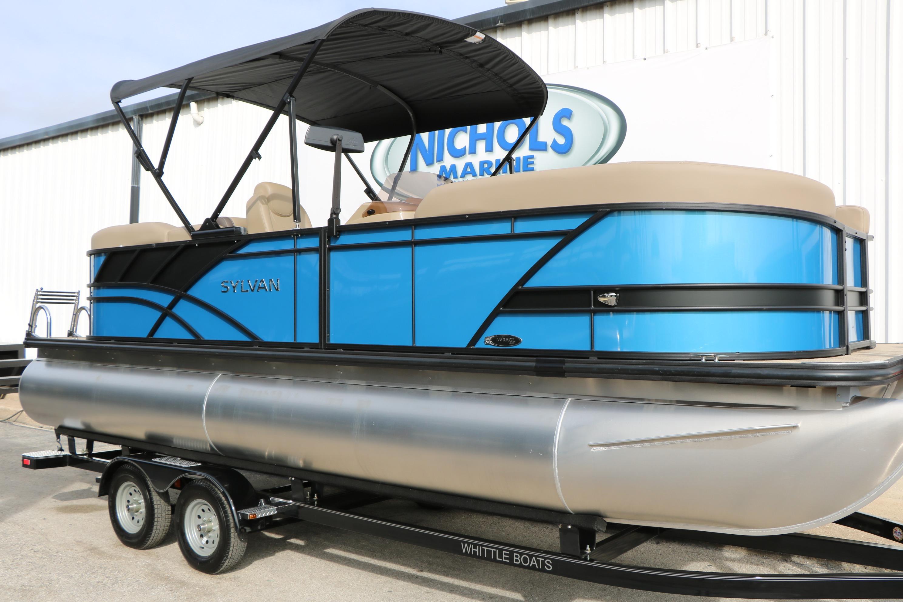 2026 Sylvan Mirage 822 LZ pontoon boat in vibrant blue on trailer.