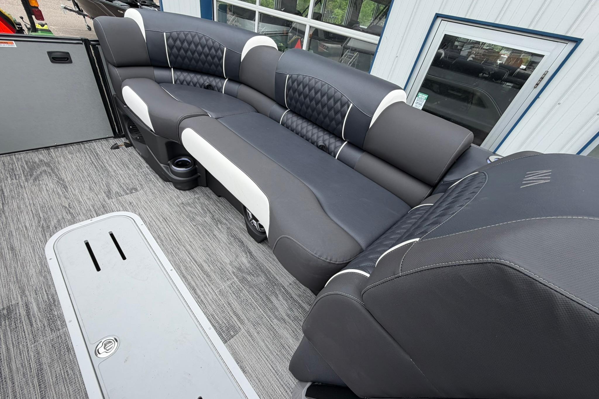 Luxurious seating on 2026 Avalon Excalibur LTD Flex Lounge Windshield boat, featuring sleek design.