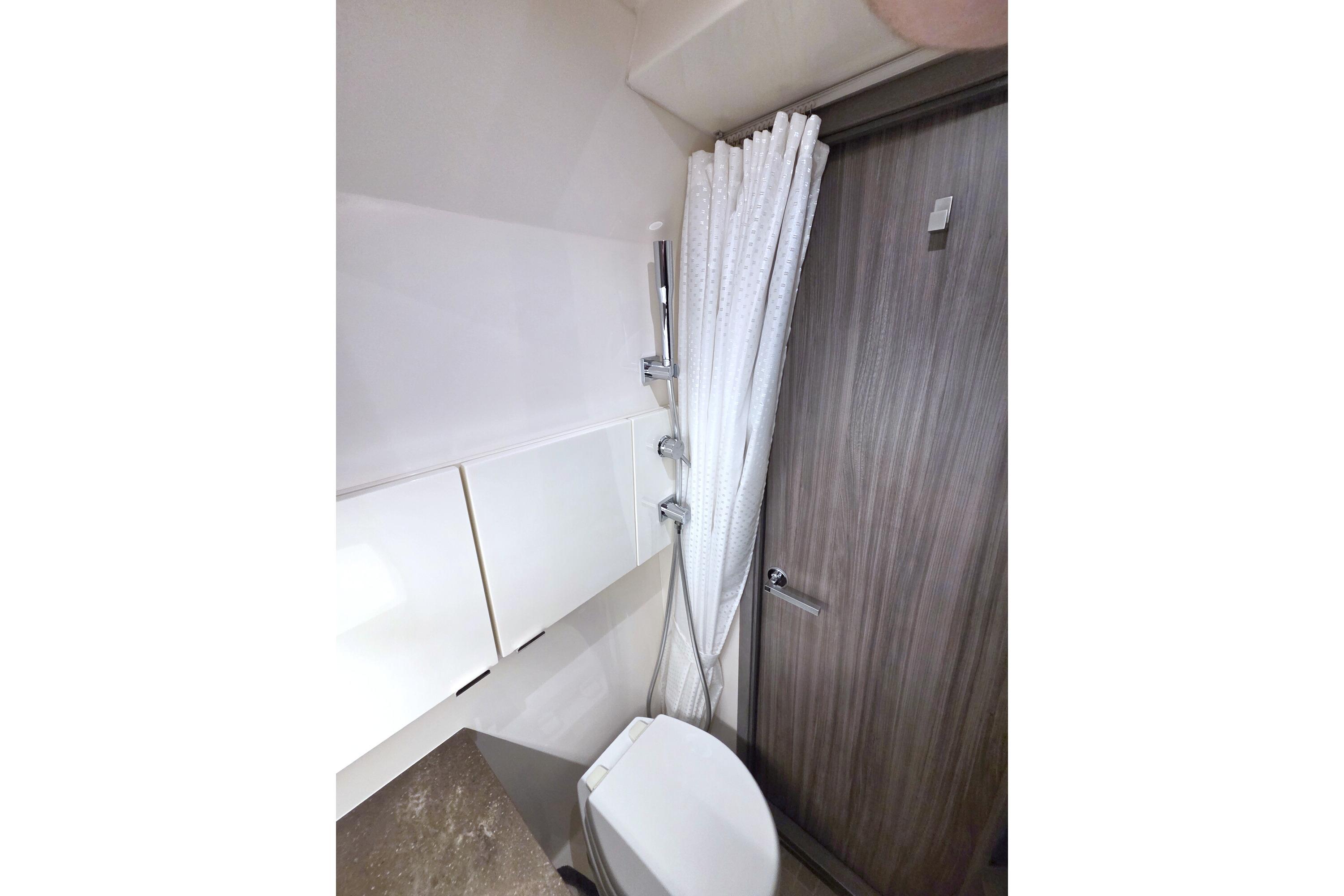 Bathroom interior of 2021 Sea Ray SLX 400 Outboard with shower and toilet.