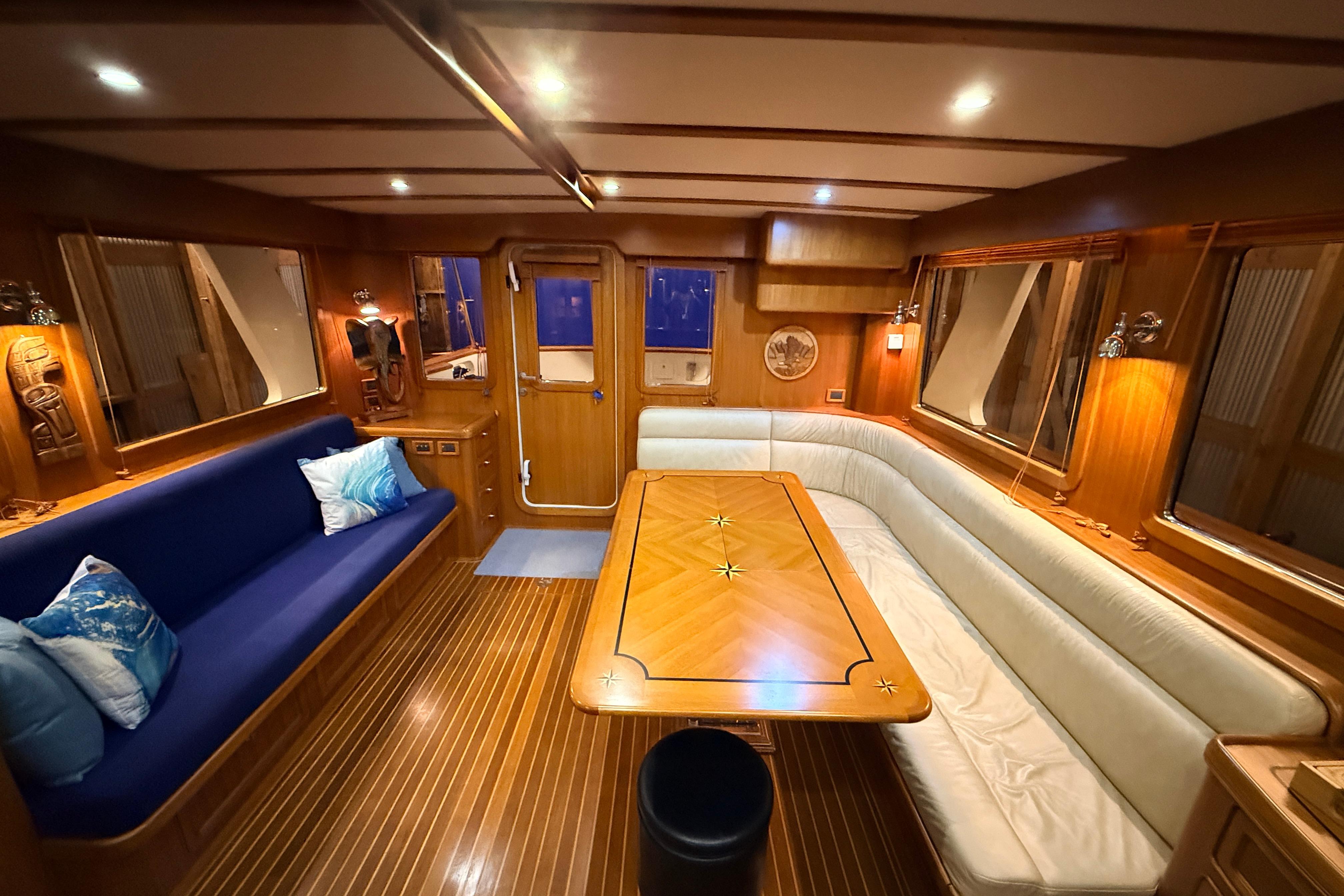 Luxurious 2006 Selene 57 yacht interior with elegant wood finishes and comfortable seating.