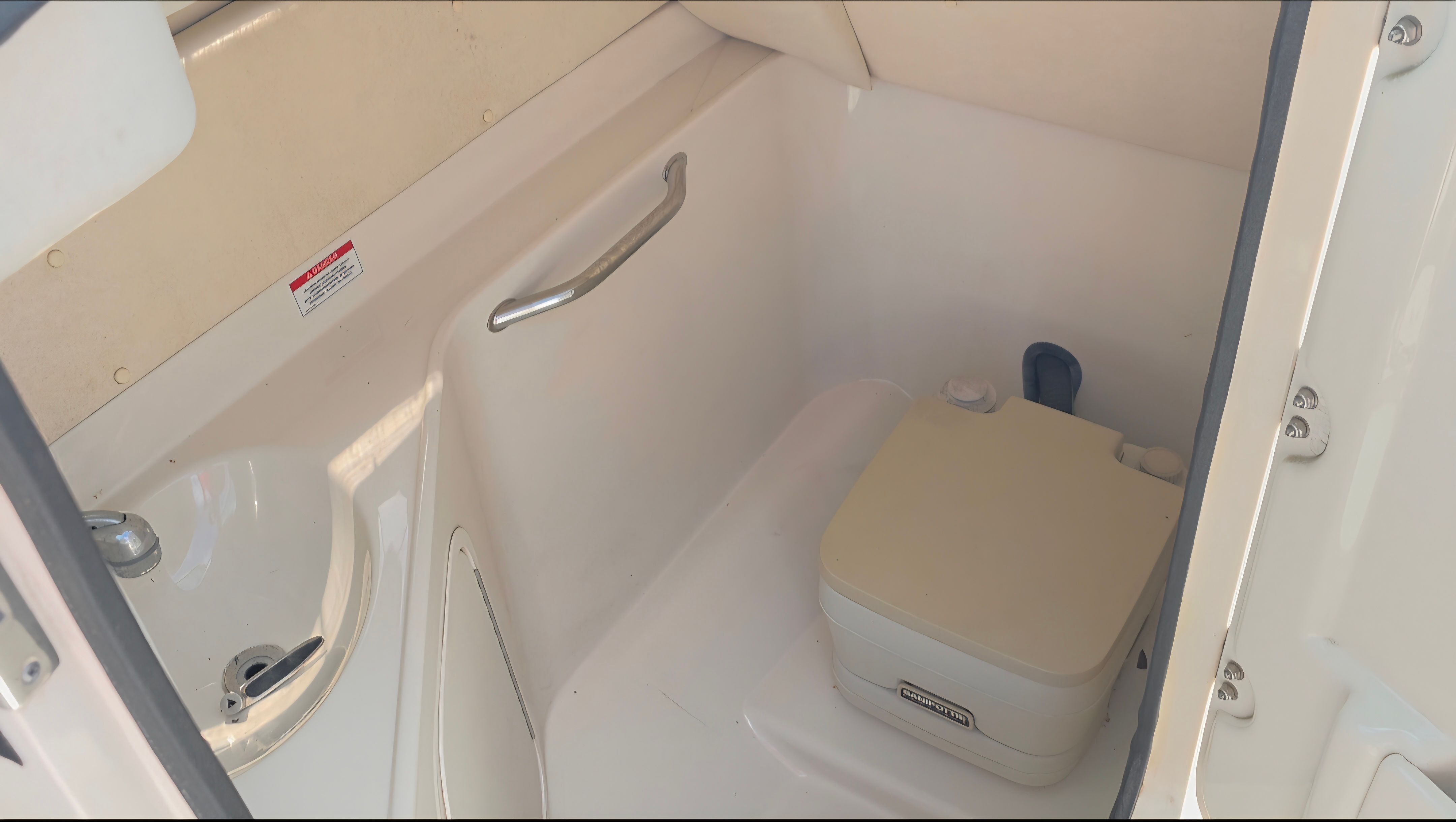 Interior of 2007 Sea Ray 260 Sundeck with toilet.