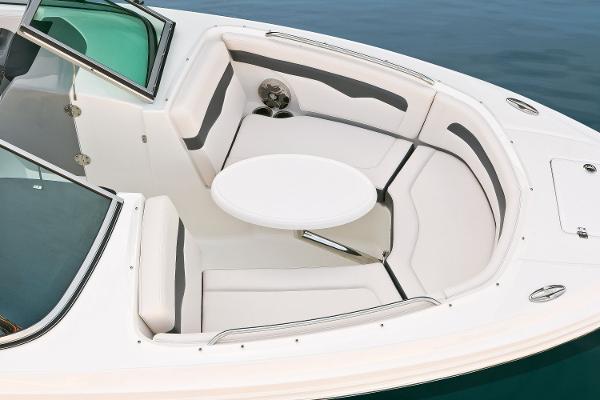 Manufacturer Provided Image: 2016 Chaparral 246 SSi boat interior with white seating and round table.