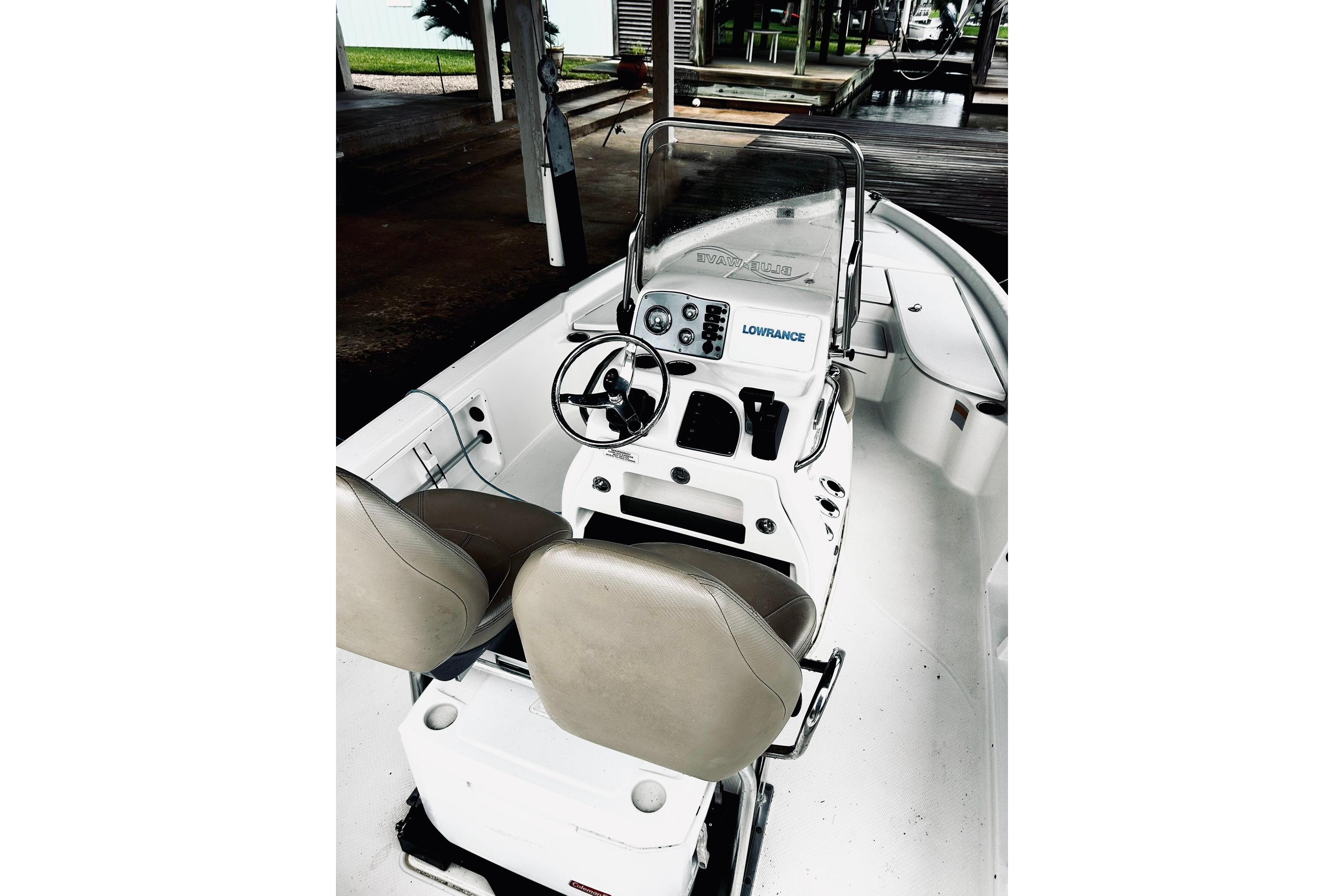 2017 Blue Wave 2200 PureBay boat interior with steering console and seating.