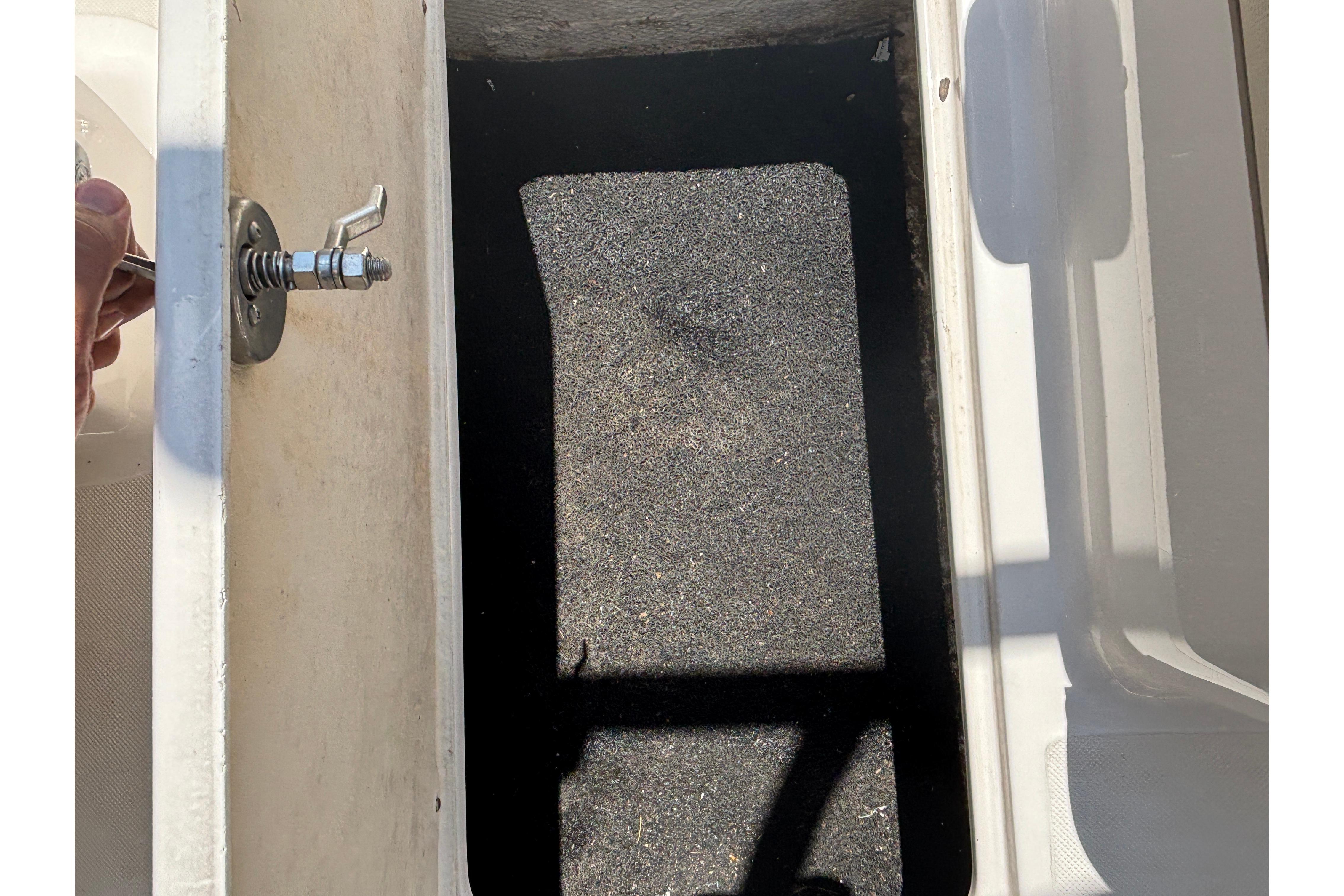Open storage compartment in a 2018 Regal 1900 ES Bowrider boat.
