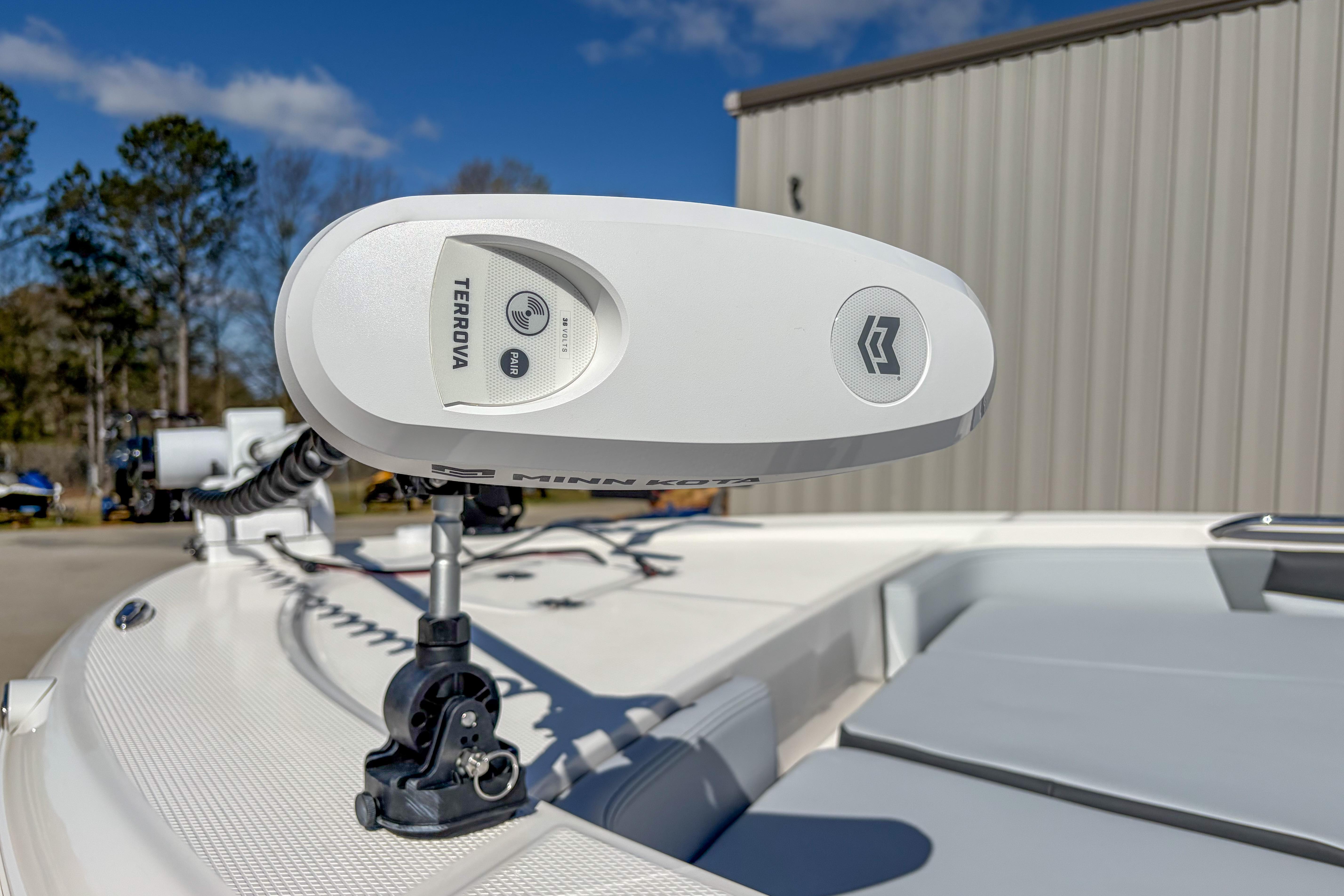 2025 Robalo 226 Cayman boat with Minn Kota Terrova trolling motor, outdoor setting.