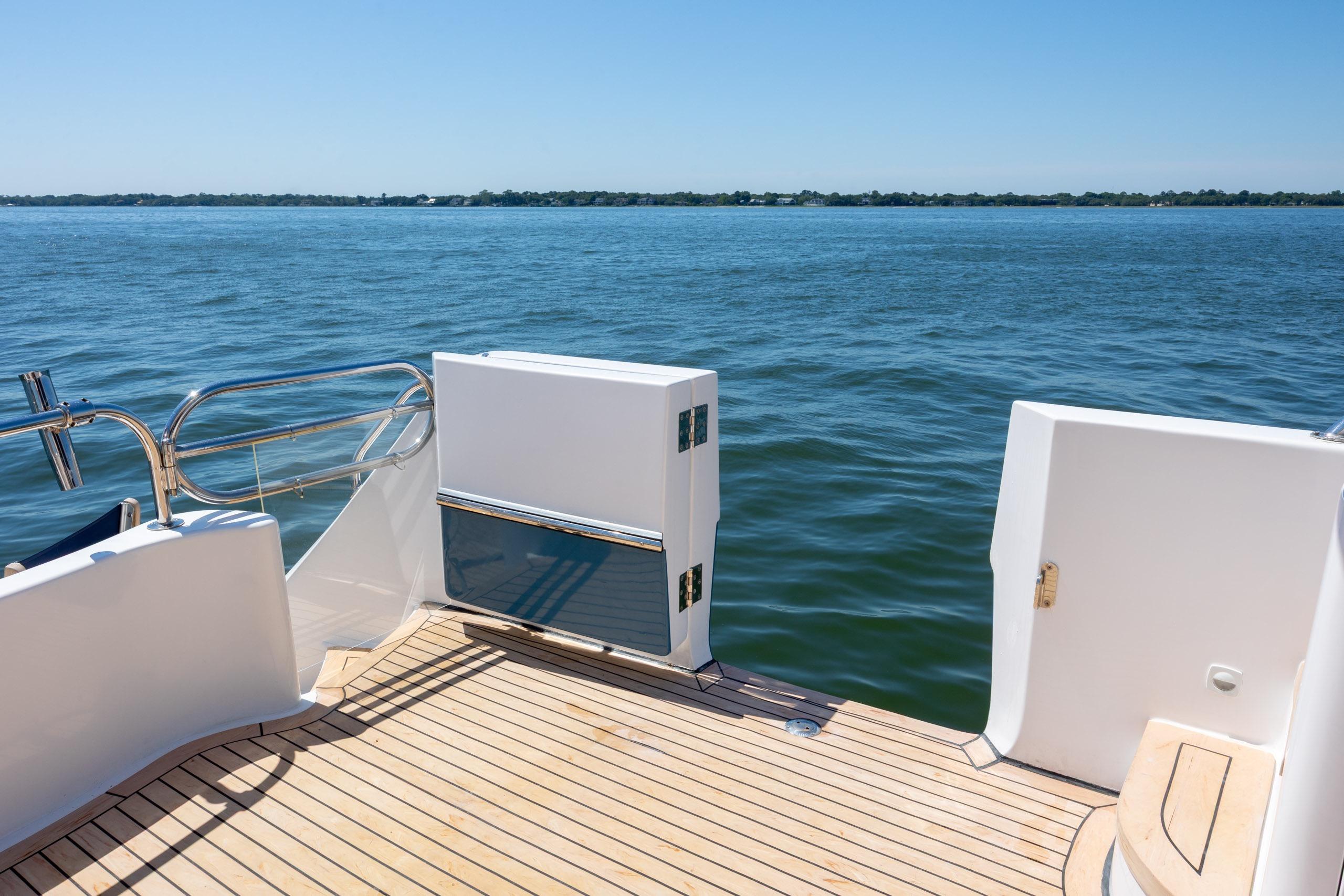 Ocean Alexander 52 Sedan yacht deck overlooking calm blue waters, 2005 model.