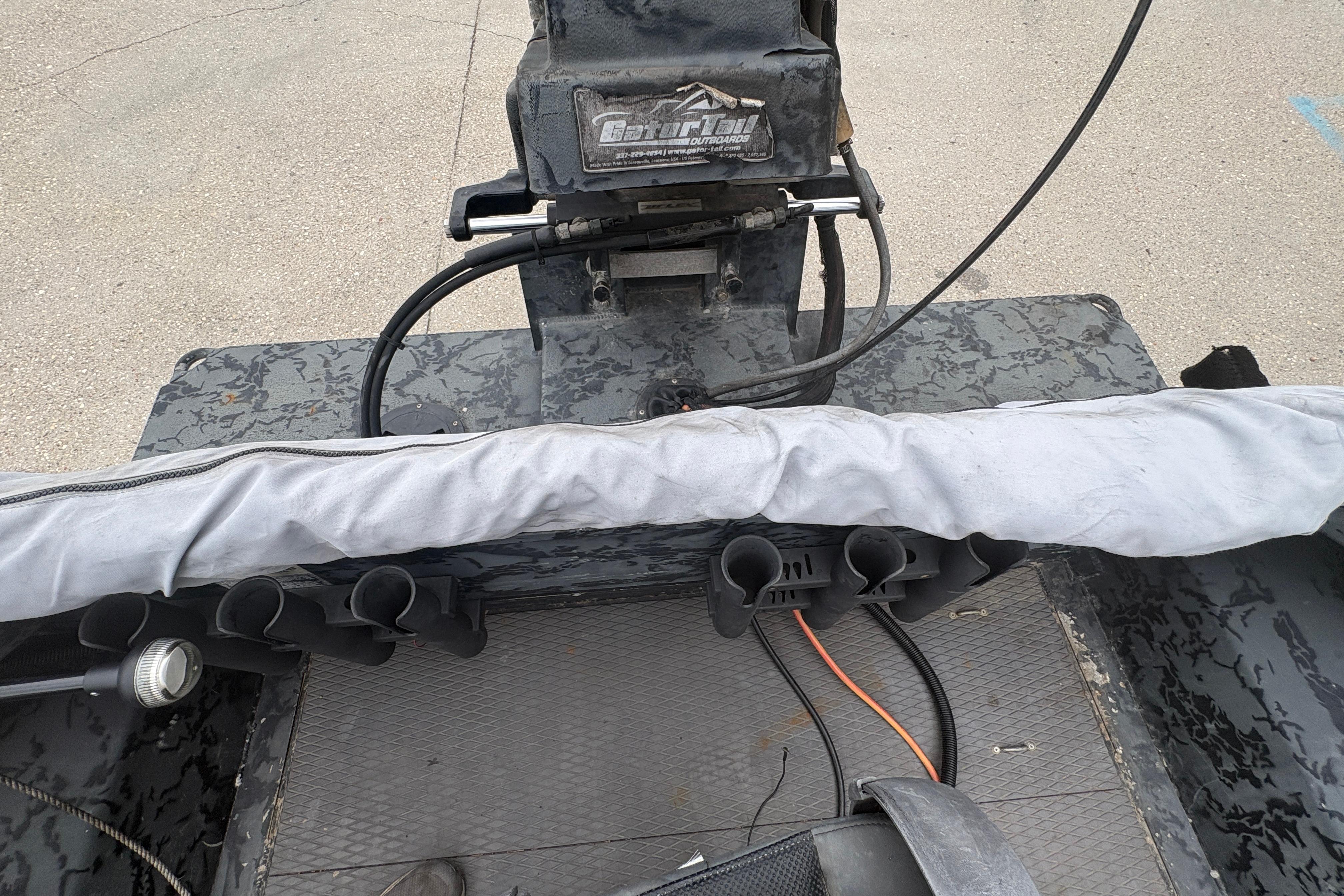 2020 Gator Tail Extreme boat interior with motor and covered seating.