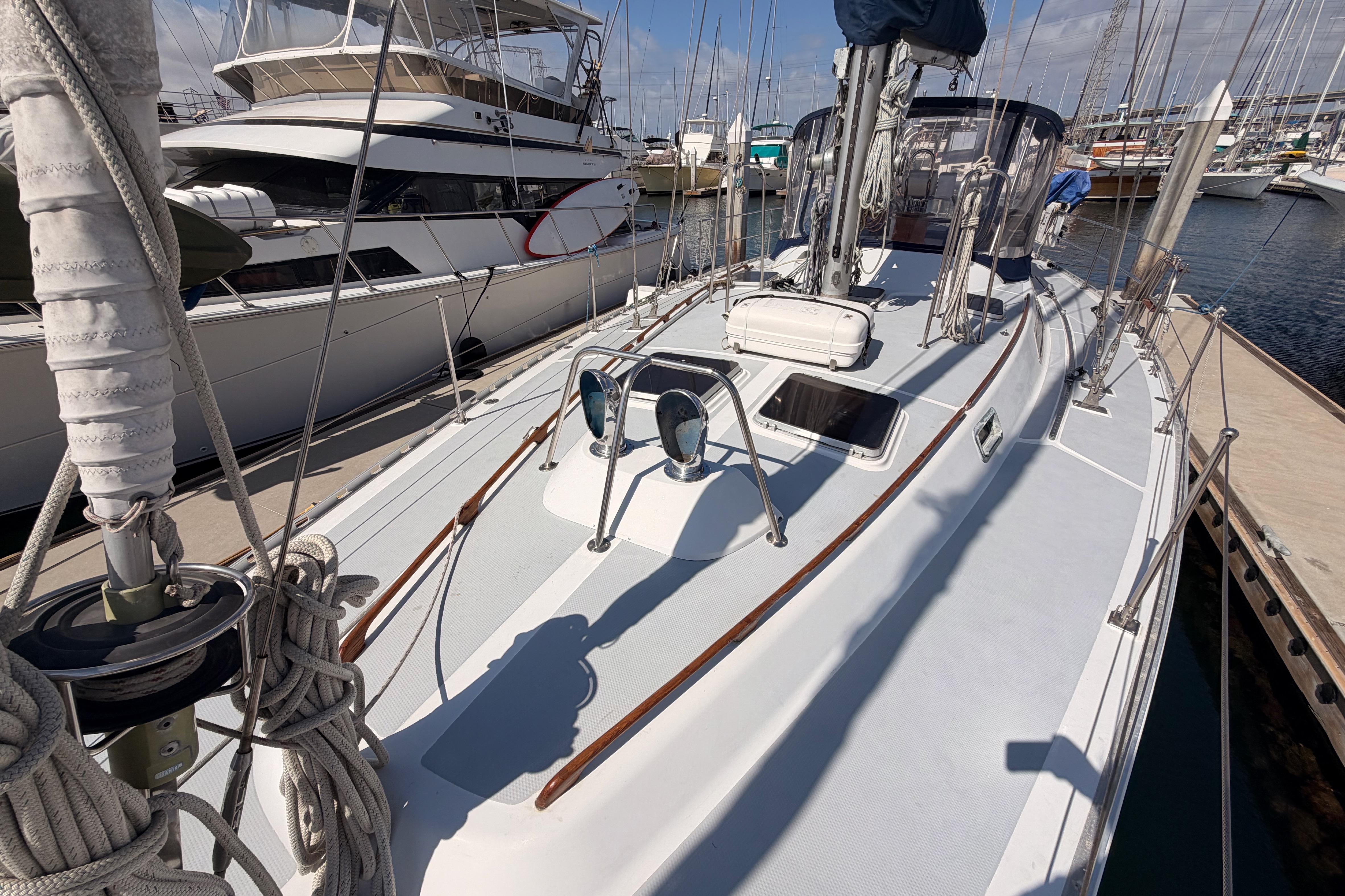 Sailboat docked at marina, Hylas 51 model, 1991, with clean deck and rigging.