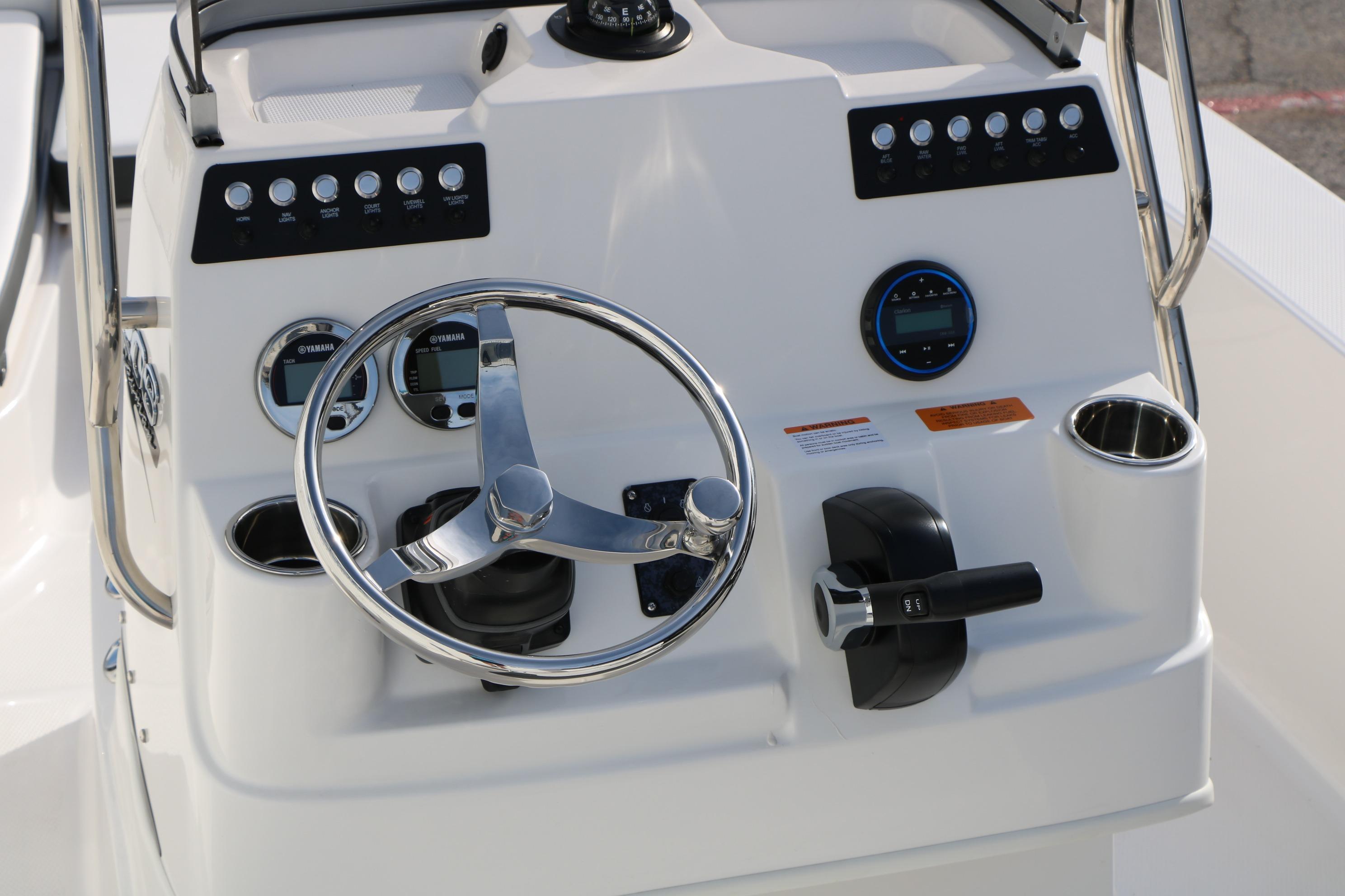2026 Robalo 206 Cayman boat console with steering wheel and control panel.