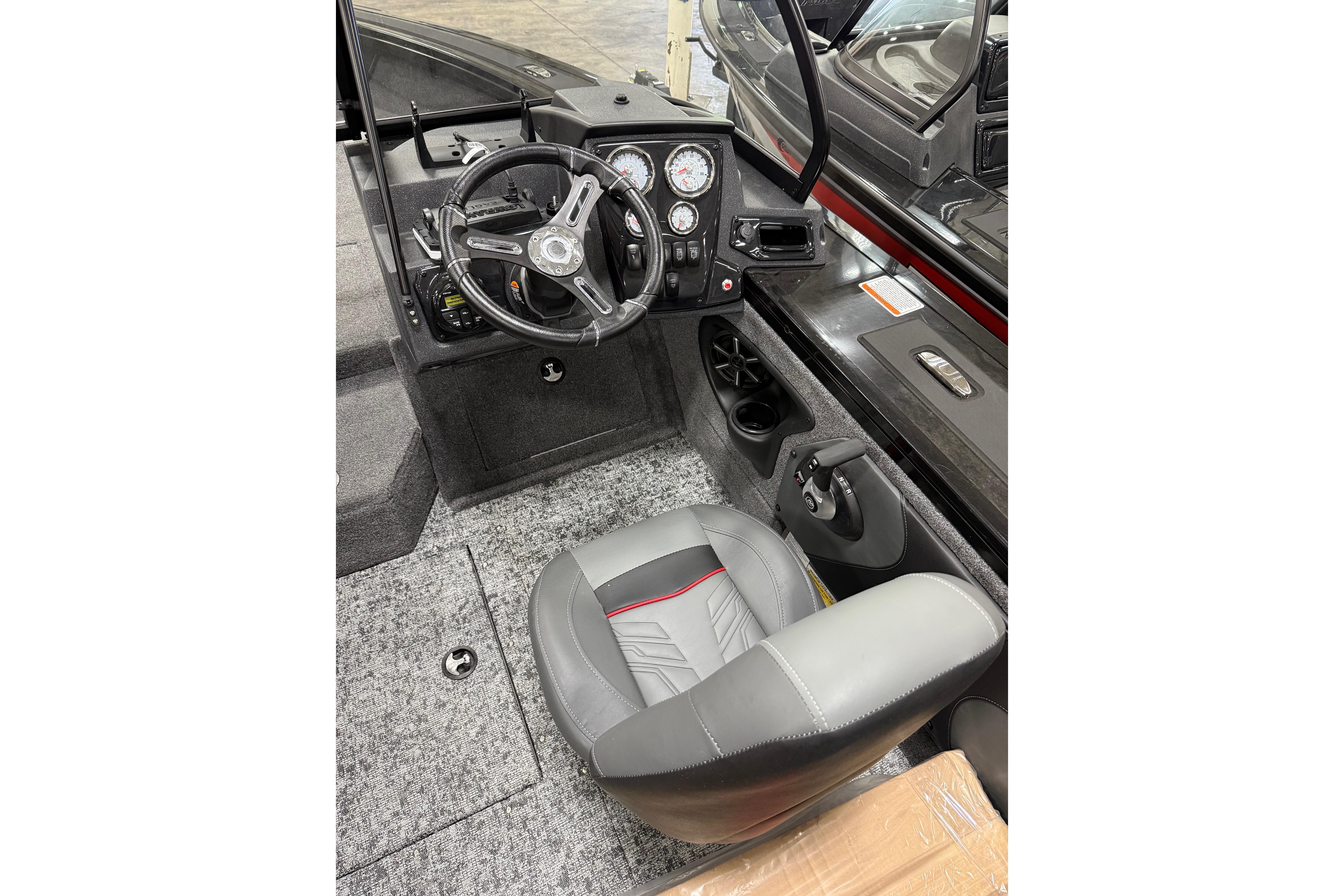 Interior of 2026 Tracker Targa V-19 WT boat with steering wheel and dashboard controls.