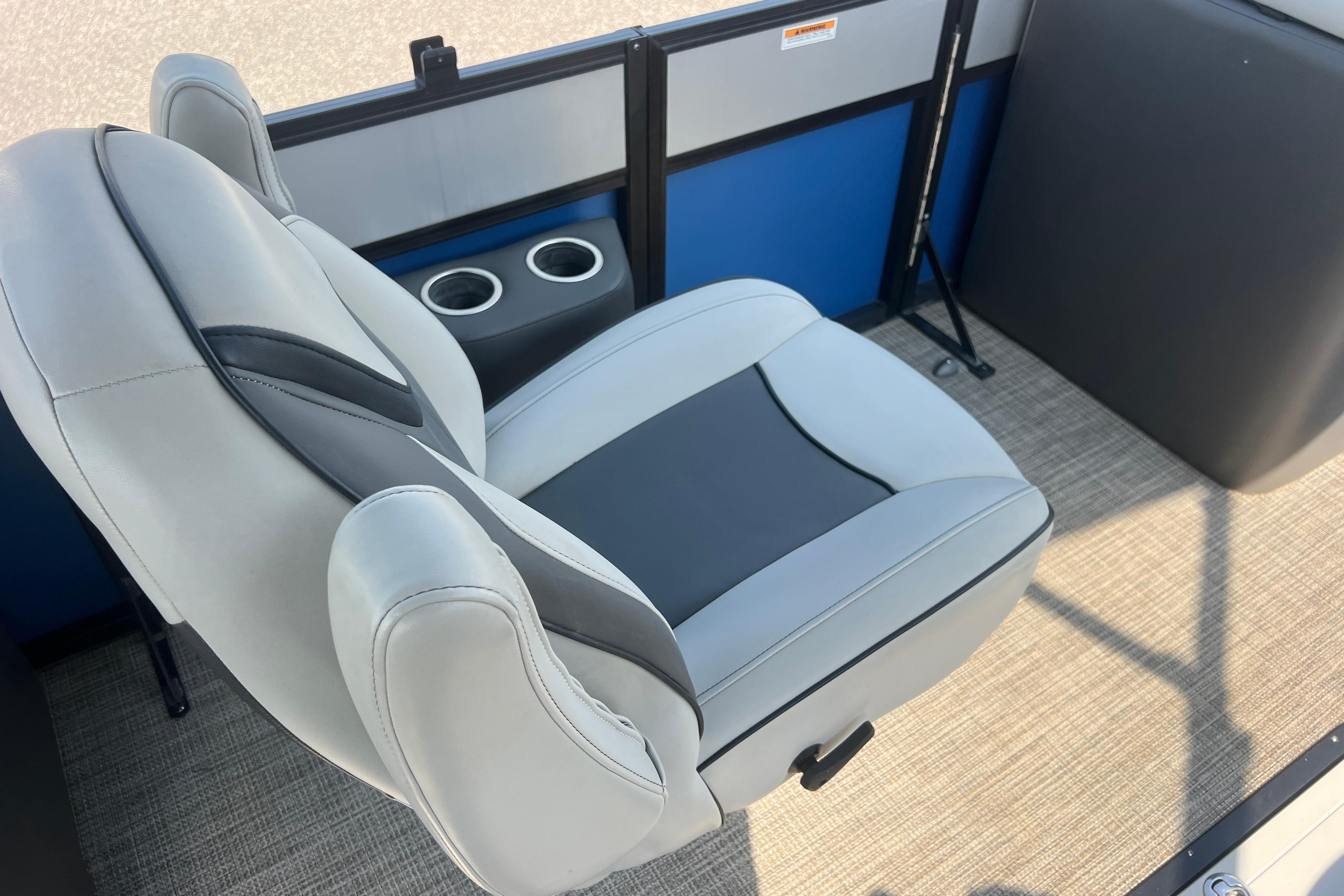 Luxurious seating on 2022 Viaggio Lago V-U 22 boat with cup holders and modern design.