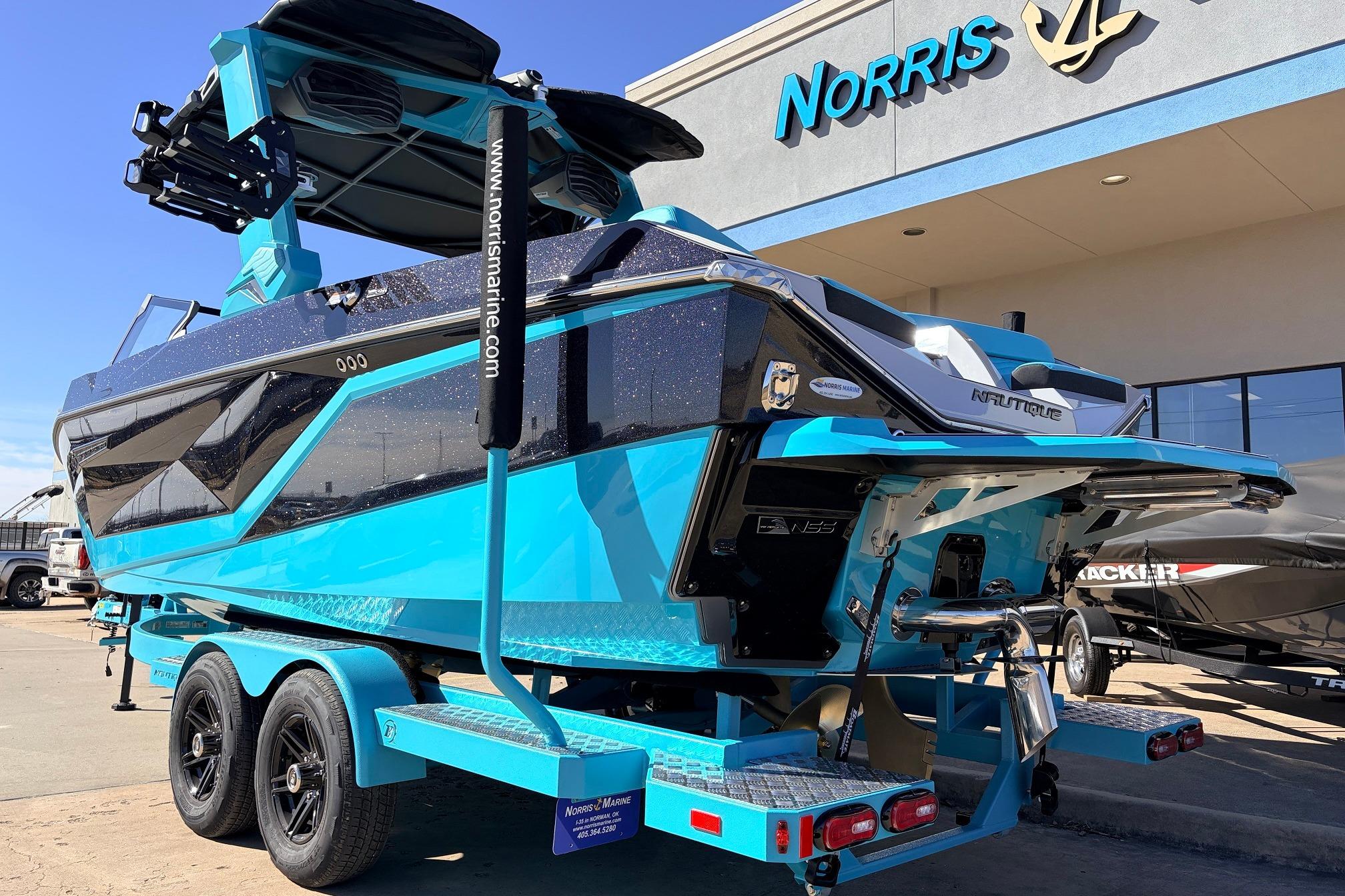 2026 Nautique Super Air Nautique G23 boat in vibrant blue at Norris Marine dealership.