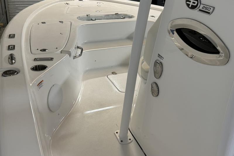 2026 Sea Pro 250 Bay boat interior with sleek white design and modern controls.