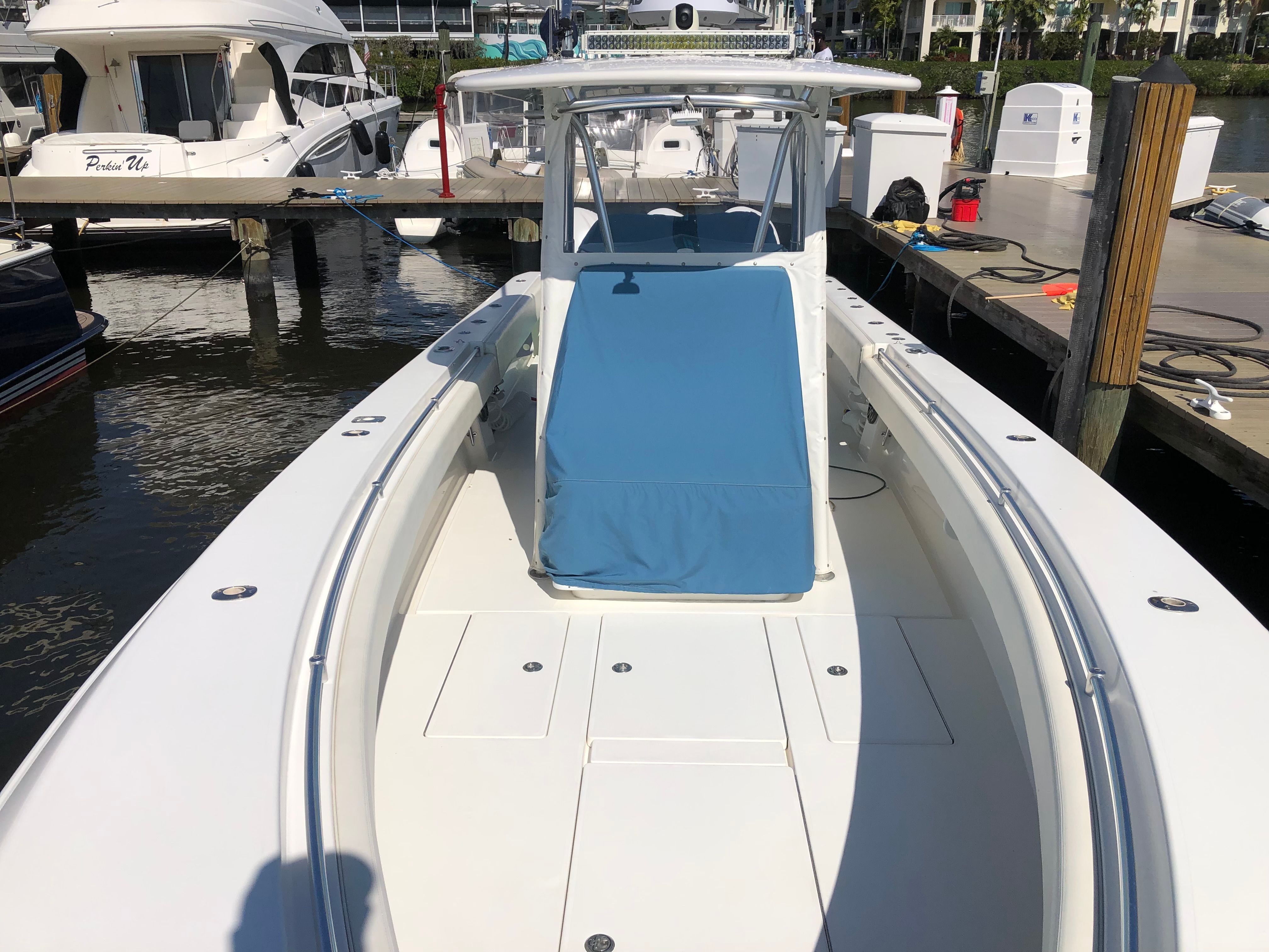 2009 Contender 33 Tournament boat at dock, front view.