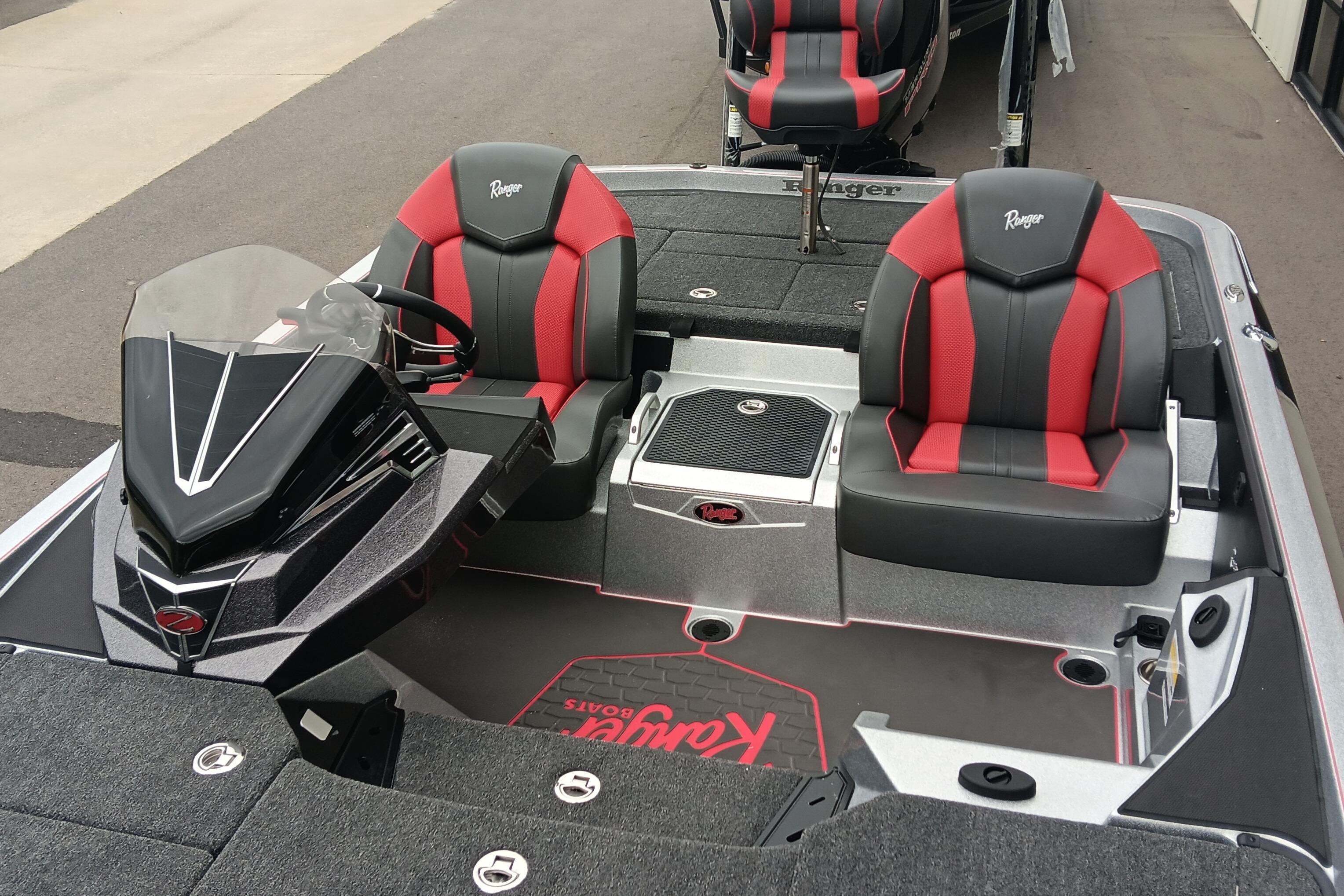 2026 Ranger Z520 boat interior with red and black seats, sleek console design.
