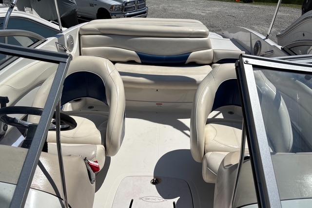 Interior of a 2012 Tahoe Q8 SSi boat with white and blue seating.