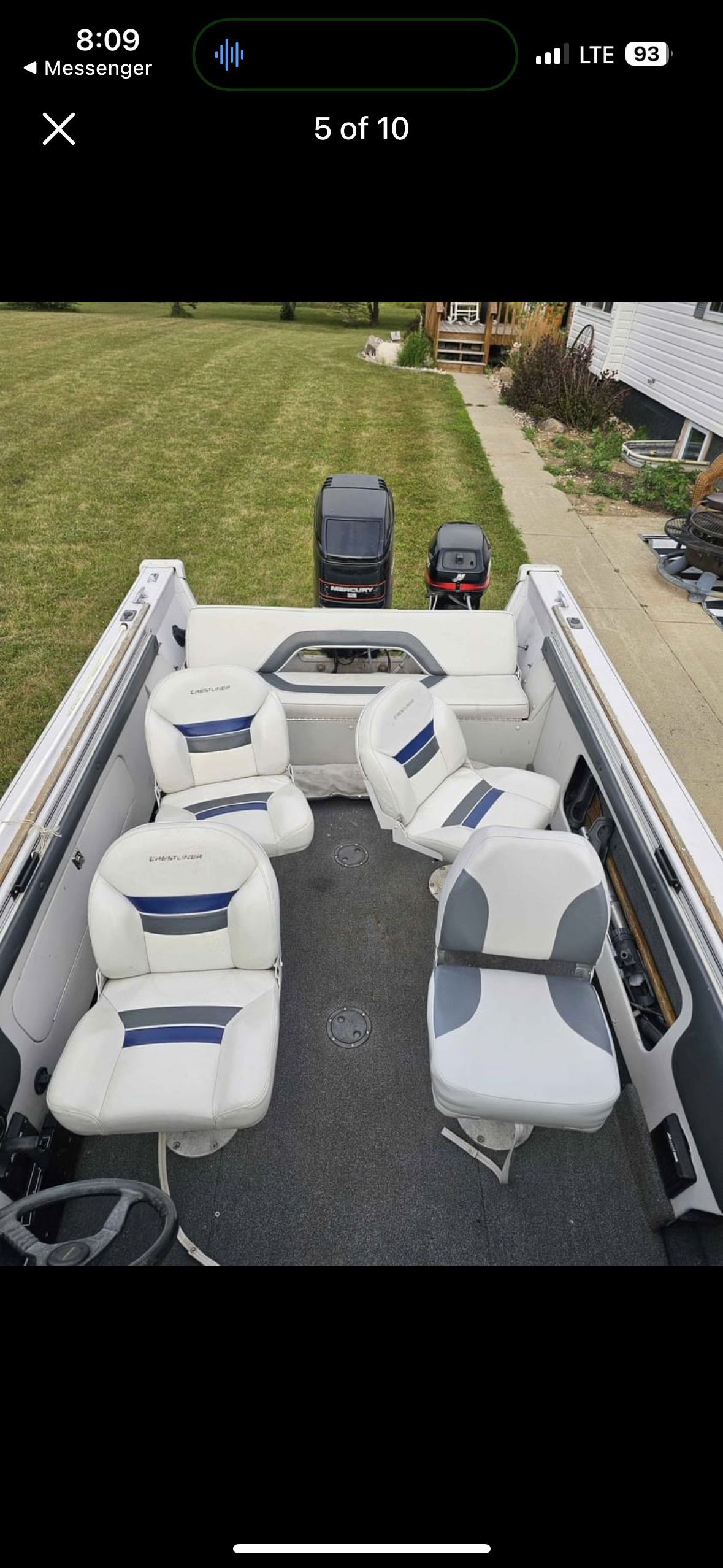 Interior view of a 1995 Crestliner Sport Fish boat with white seating.