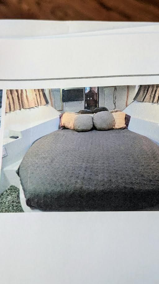 Interior of 1996 Blue Water Motor Yacht with cozy bed.