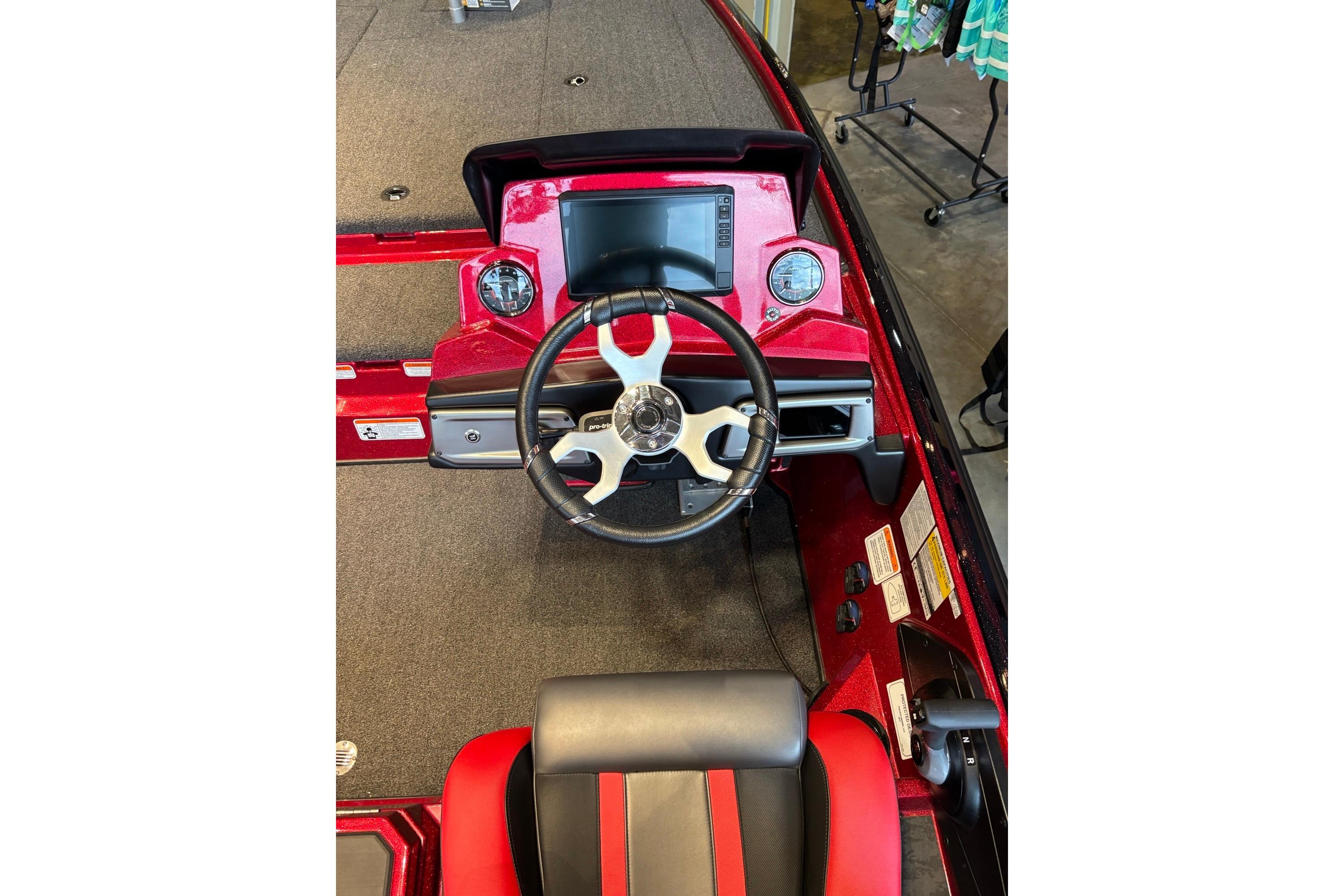 2026 Nitro Z20 XL Pro boat cockpit with steering wheel and dashboard controls.