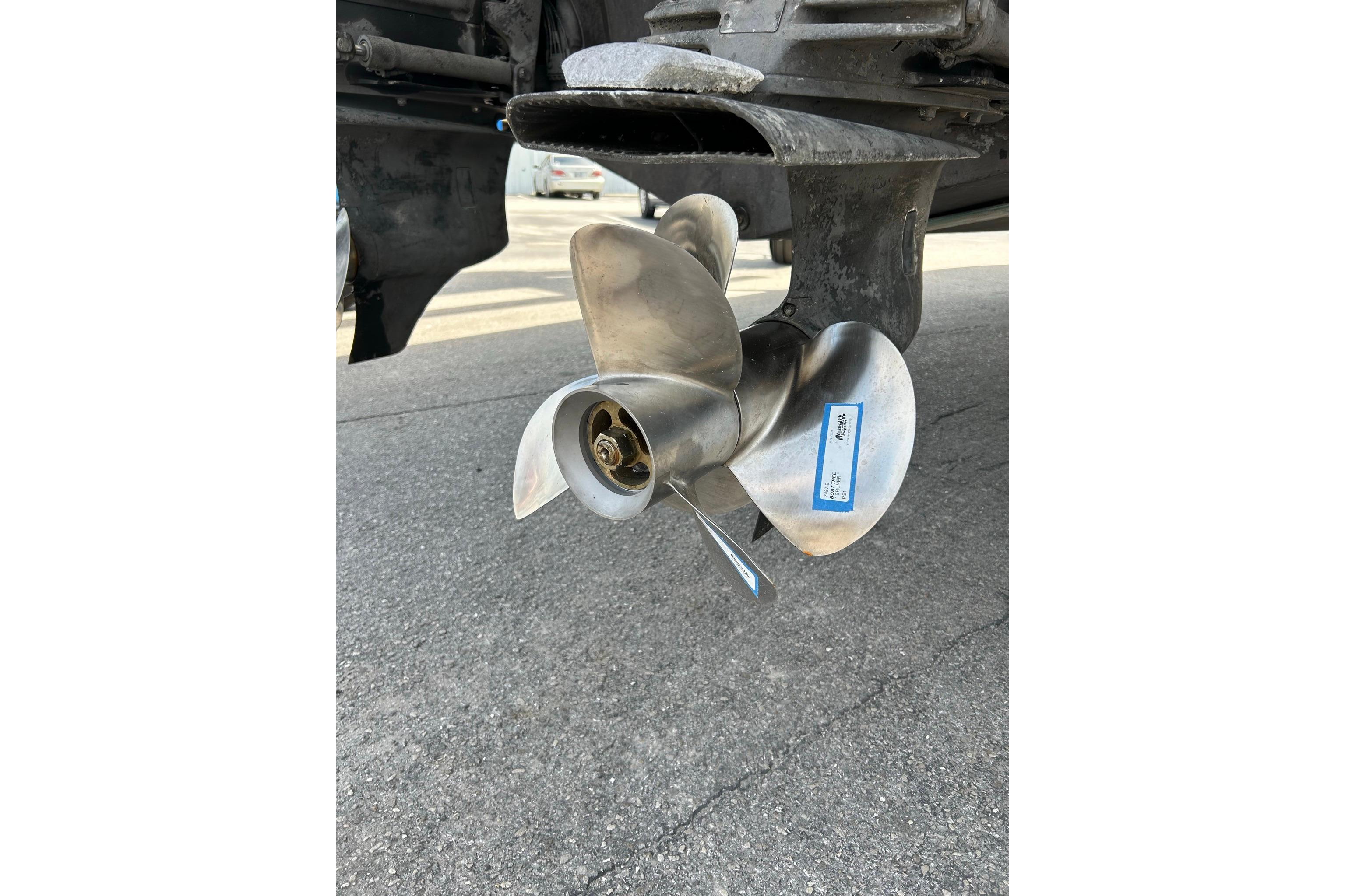 Propeller of a 2019 Monterey 335 Sport Yacht on pavement background.