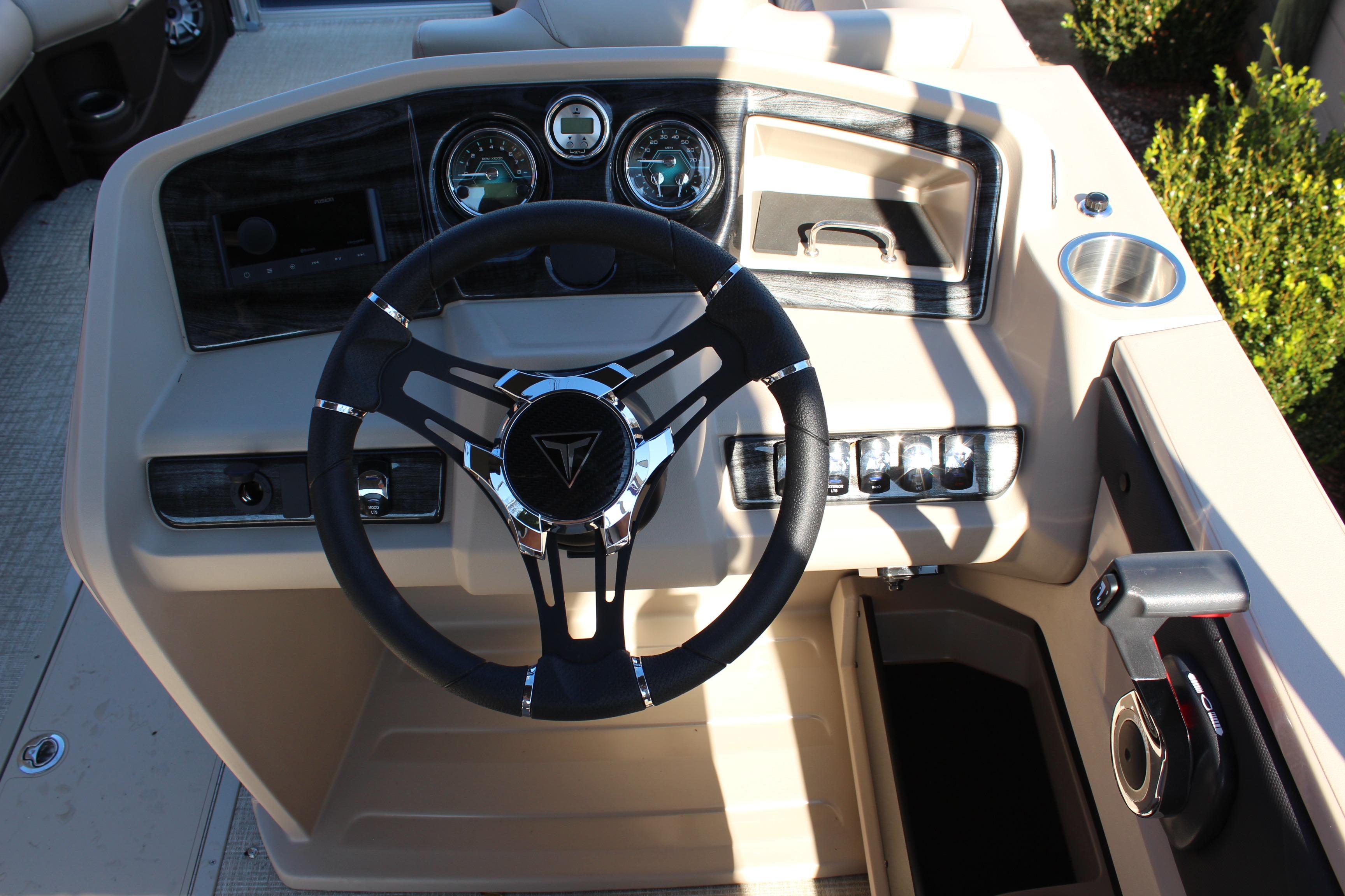 2026 Tahoe Pontoon LTZ Elite dashboard with steering wheel and control panel.