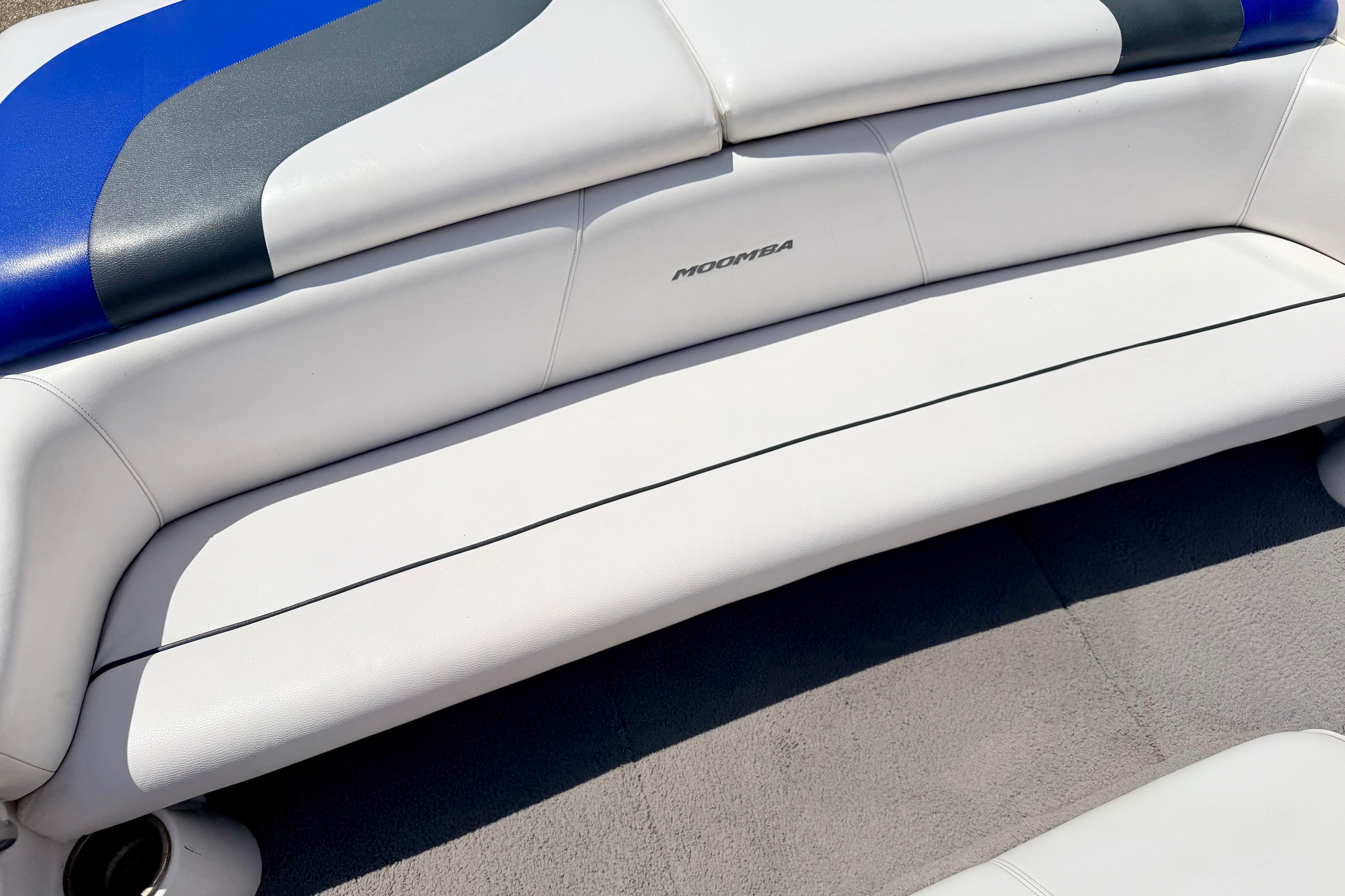 2008 Moomba Outback V boat interior with white and blue seating.