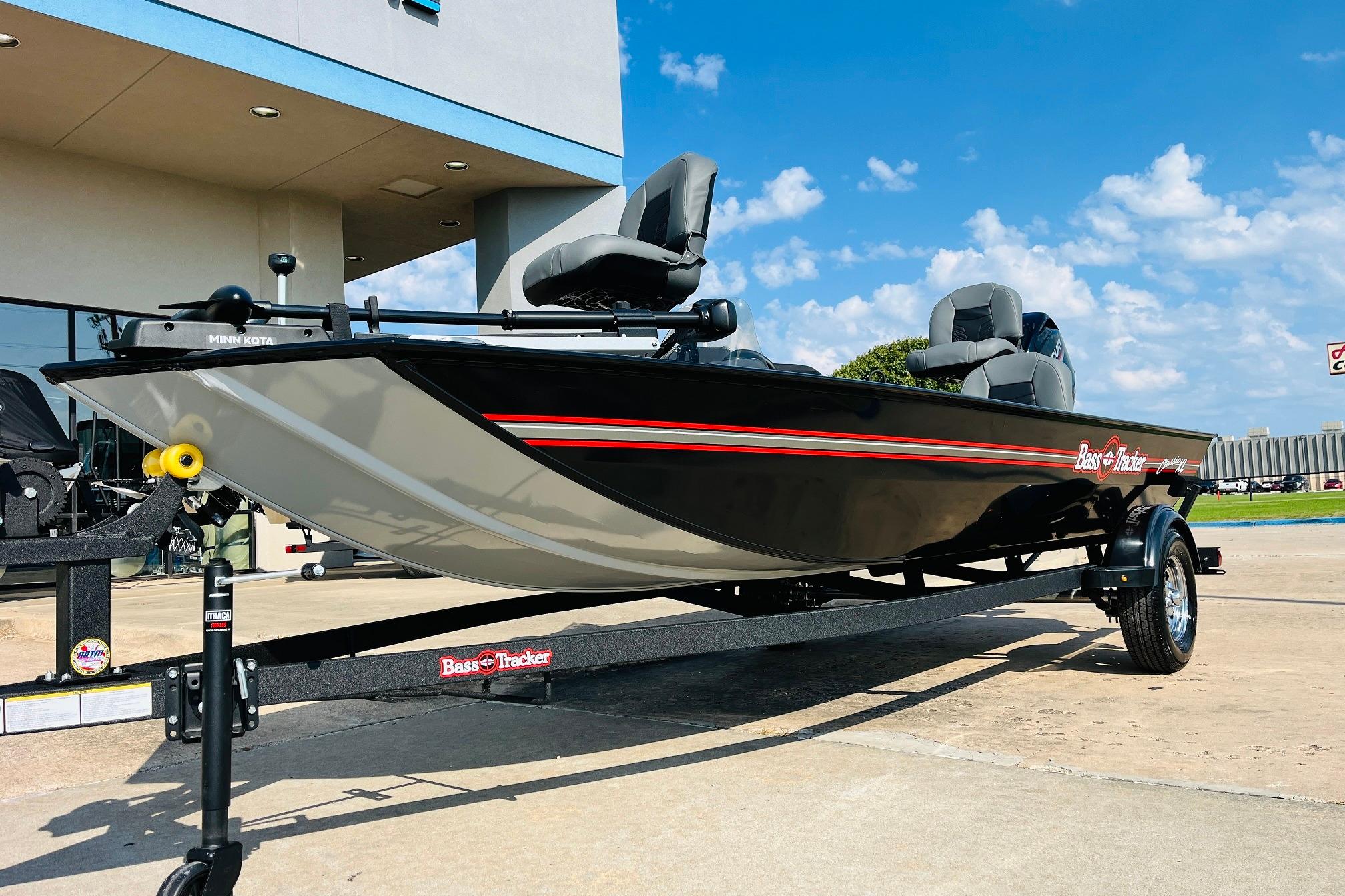 2026 Tracker Bass Tracker Classic XL boat on trailer, parked outdoors under blue sky.