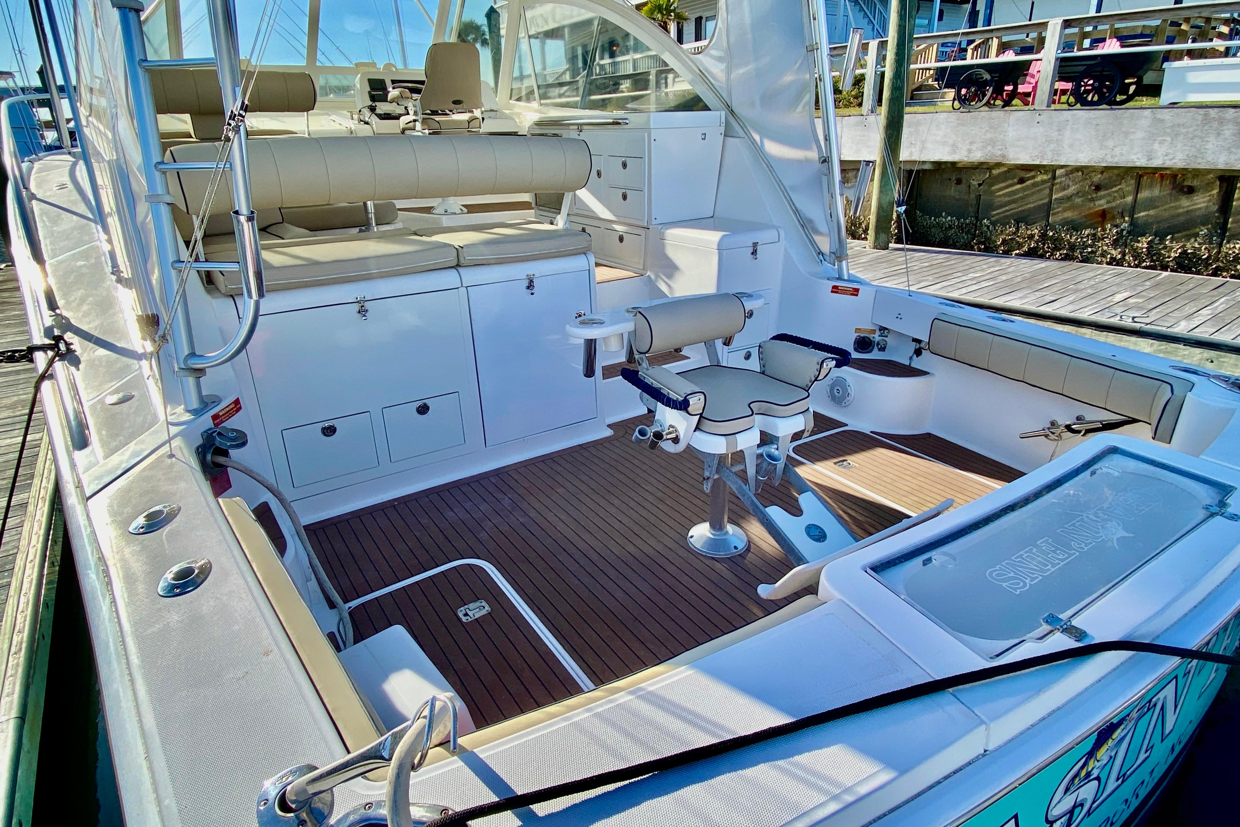 2006 Luhrs 41 Open boat interior with seating and fishing chair.