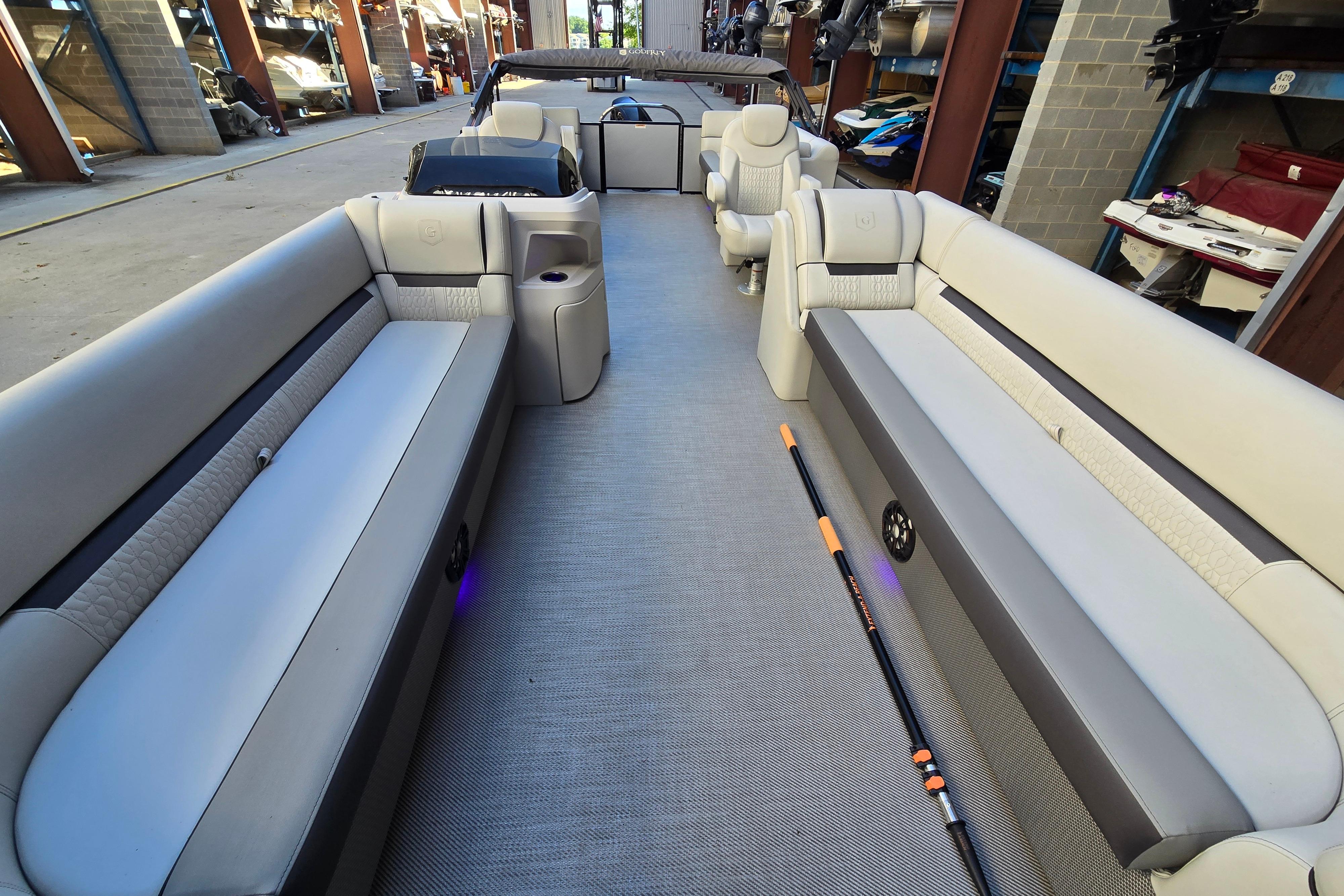 Interior of 2024 Godfrey Sweetwater 2486 SB pontoon boat with spacious seating.