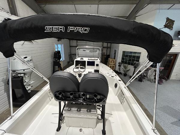 2025 Sea Pro 210 Bay boat interior with seating and console.