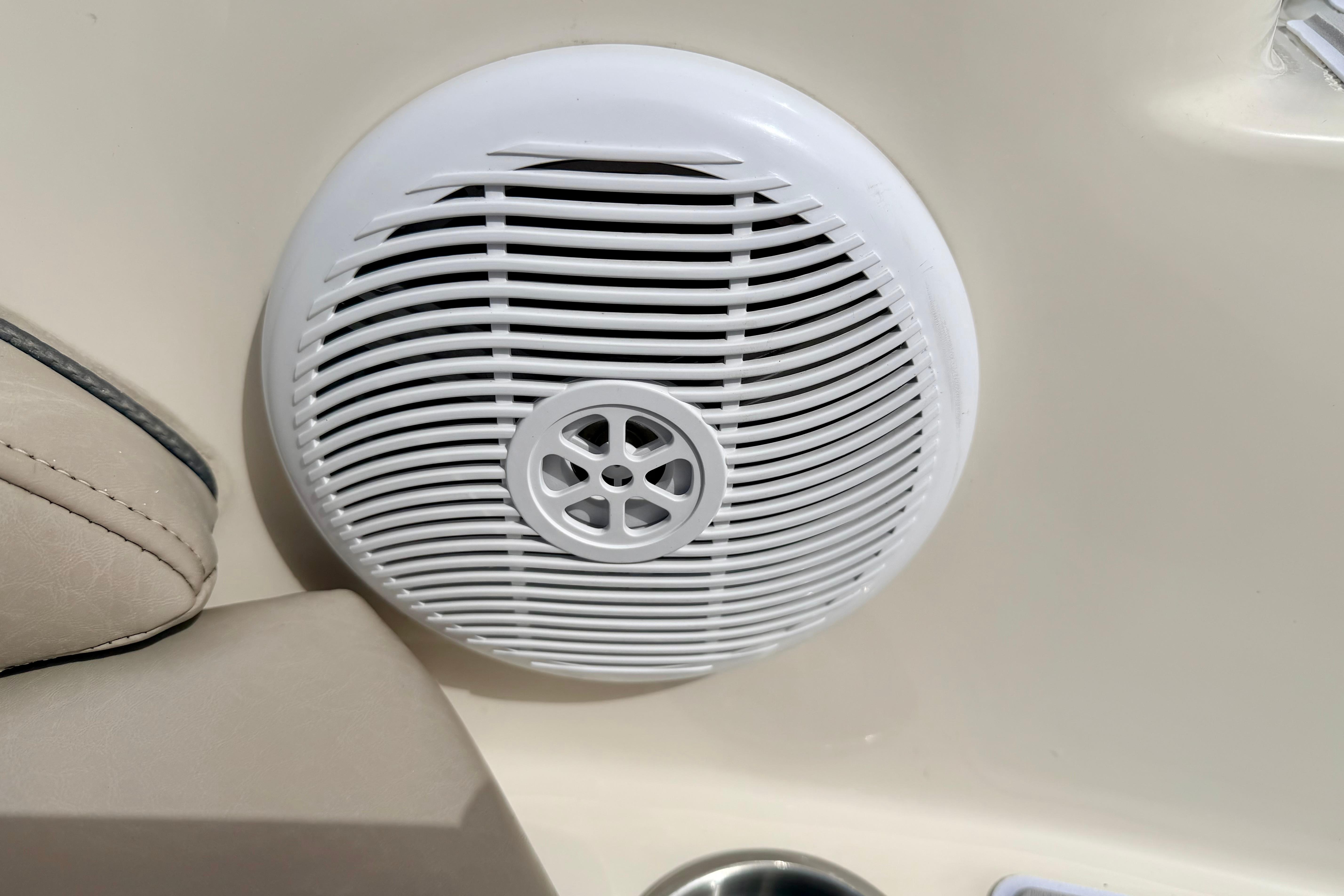 White speaker on a 2003 Sea Ray 200 Sundeck boat interior.