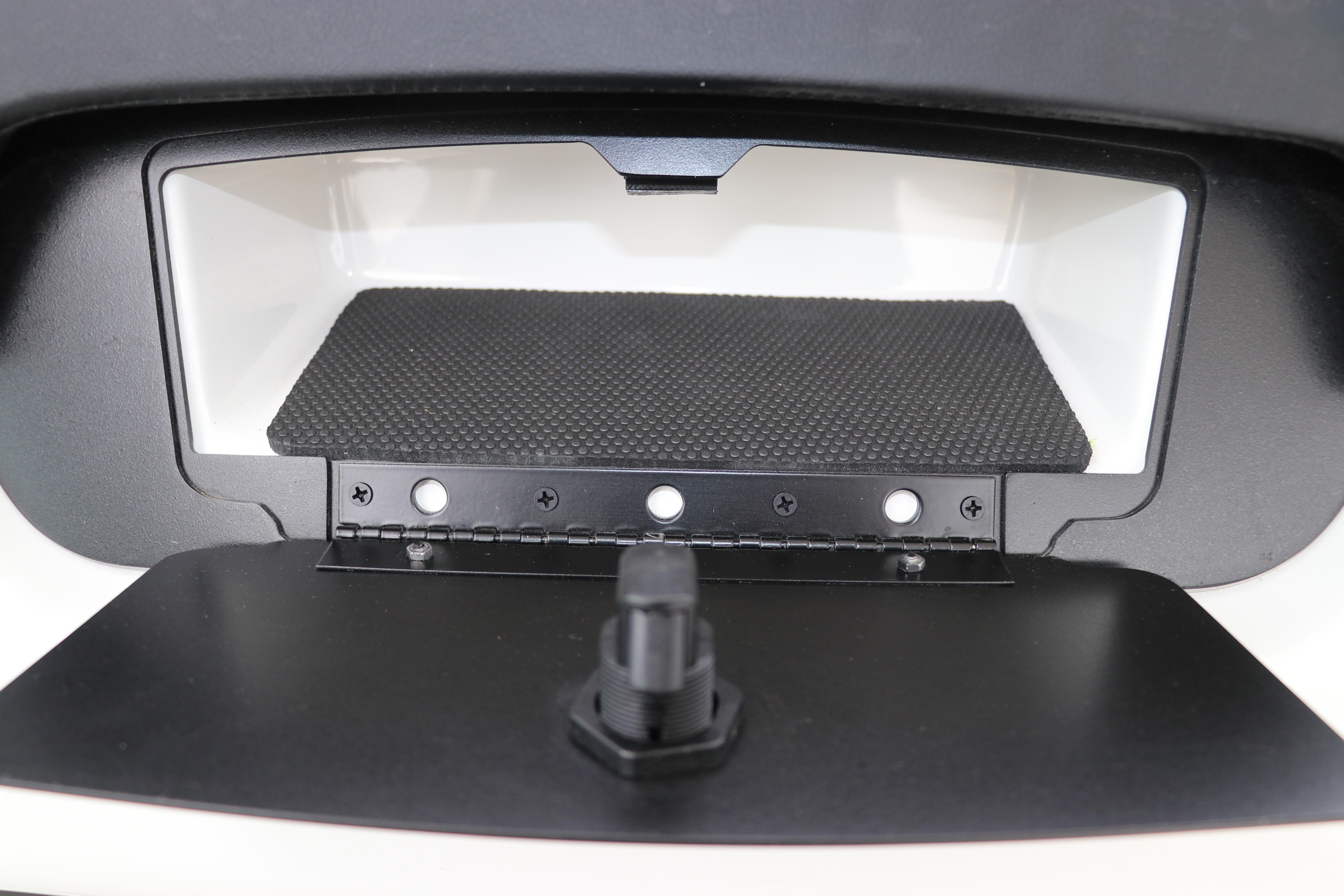 2026 Robalo R257 Dual Console storage compartment with black textured mat and latch.
