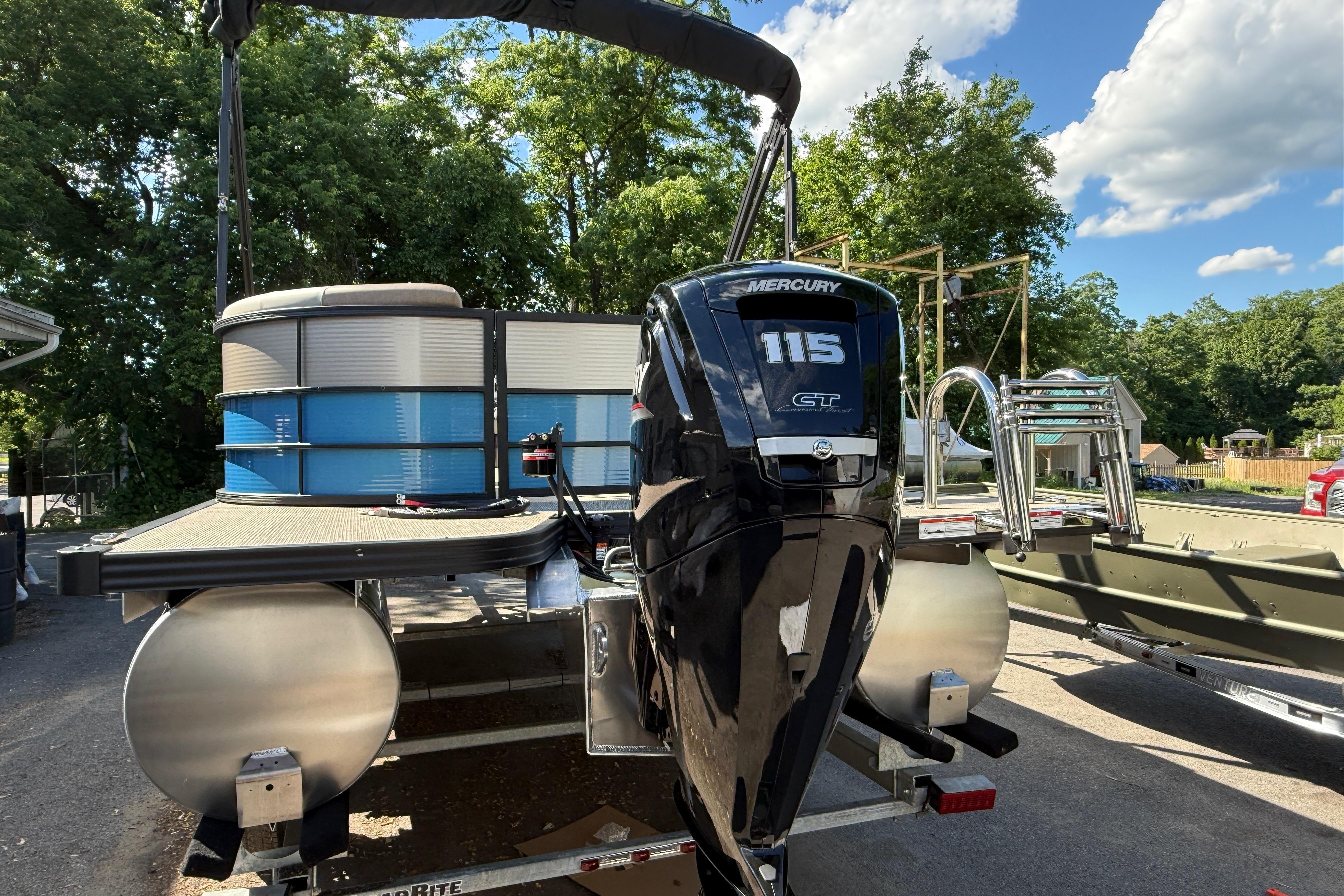 2027 Manitou Aurora RF 23 pontoon boat with Mercury 115 GT outboard motor.