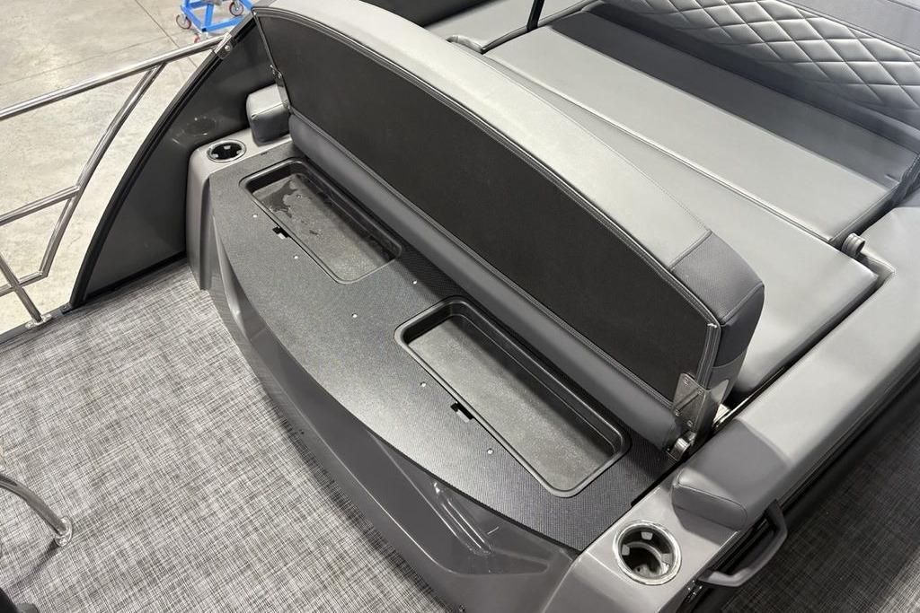 2026 Godfrey Monaco 235 SFLC boat interior with gray seating and storage compartments.