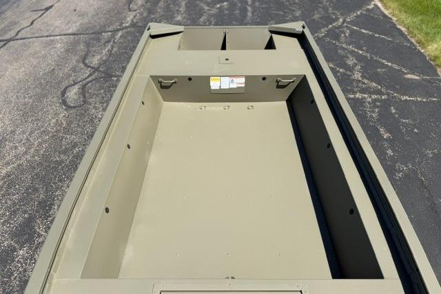 2026 Tracker Grizzly 1754 Utility boat interior on asphalt surface.