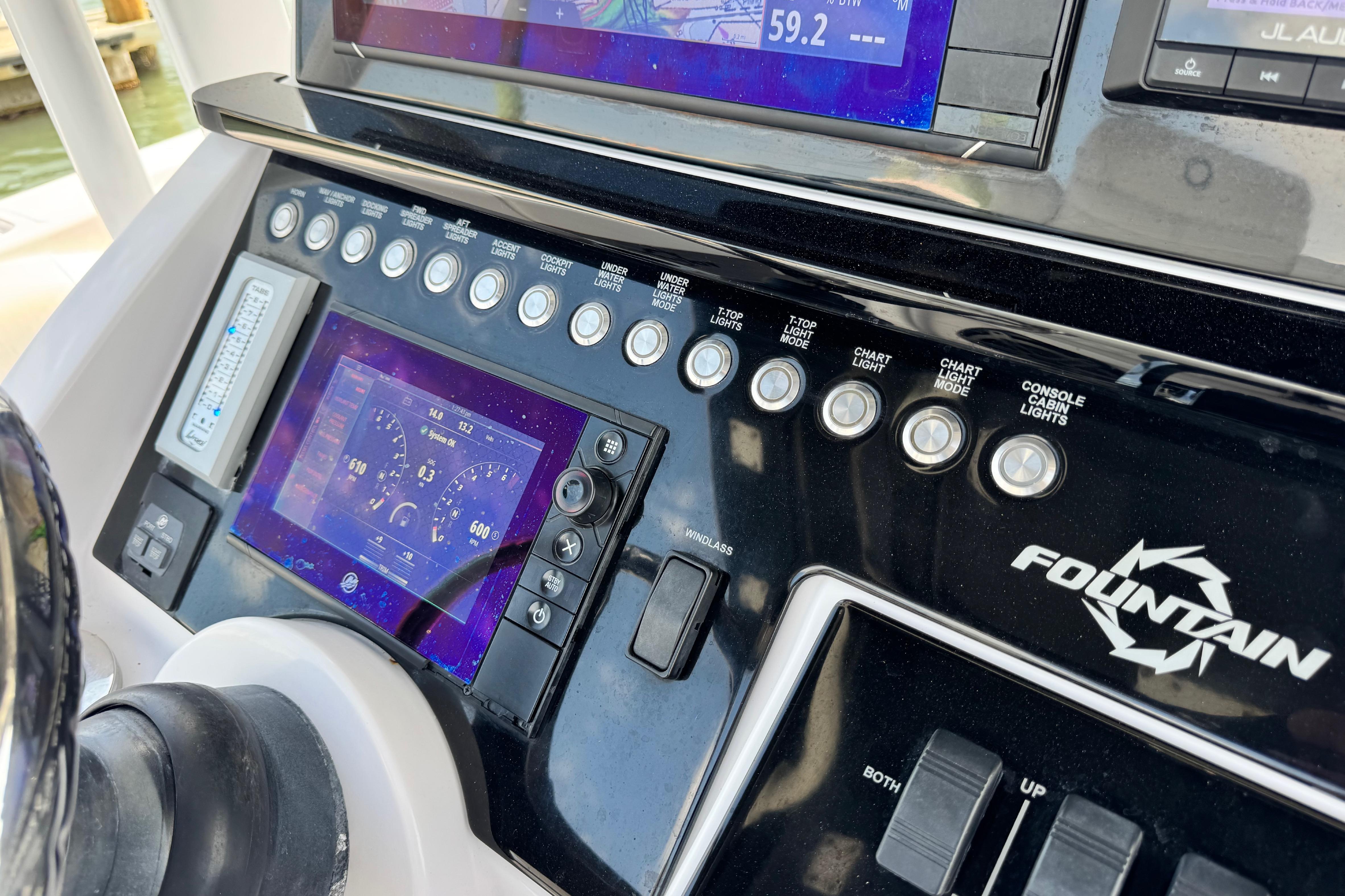 Control panel of a 2018 Fountain 34 Center Console boat with digital displays and switches.