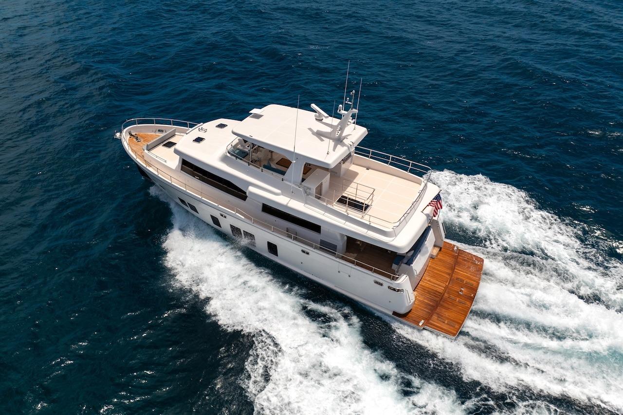 Luxurious 2027 Offshore Yachts 70 CE cruising on open ocean waters.