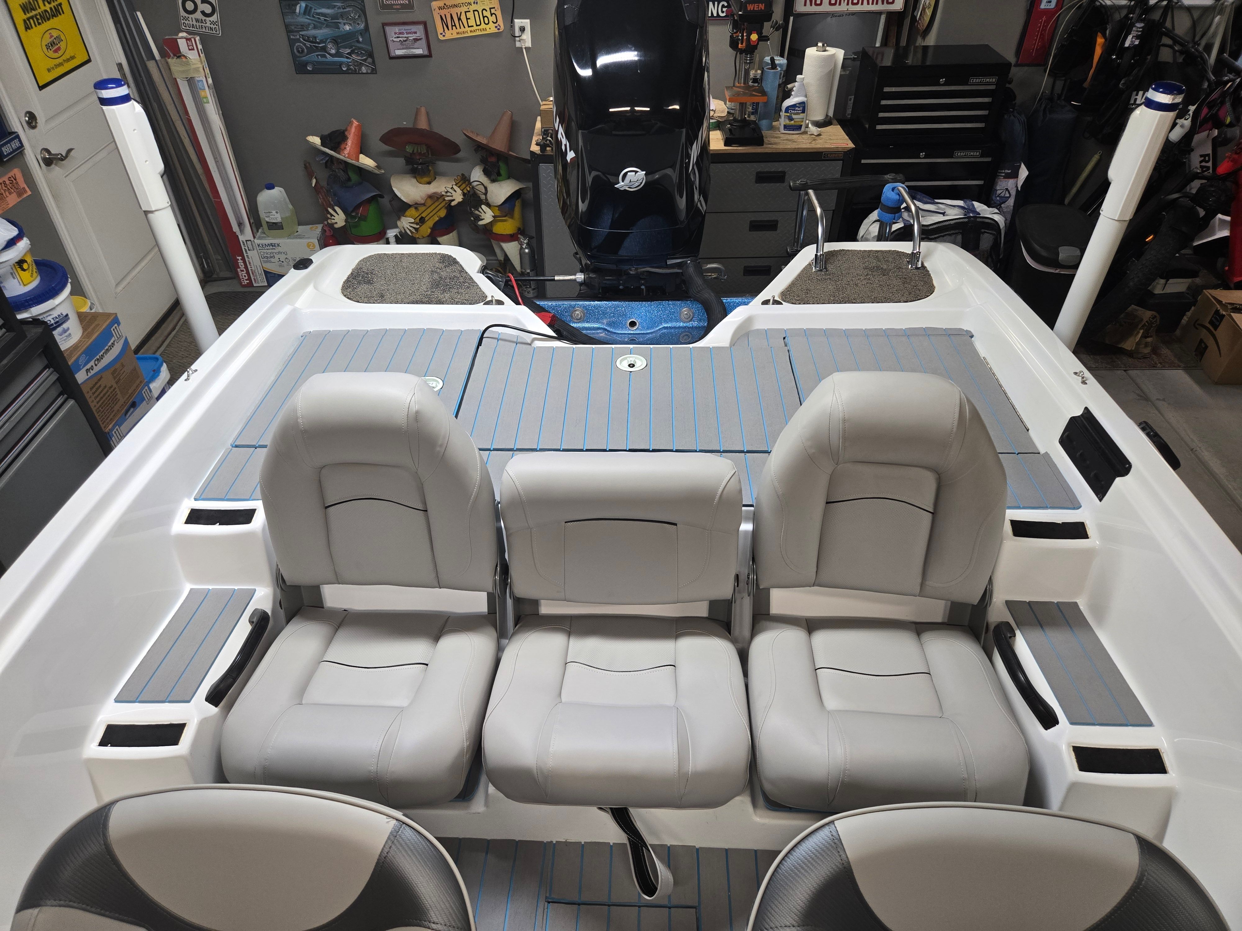 Interior view of a 2007 ProCraft 170 Combo with gray seats and blue accents.