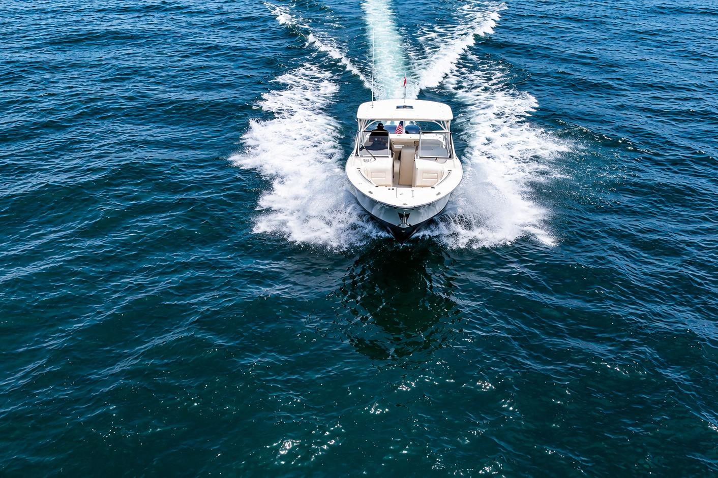 2019 Grady-White Freedom 307 boat cruising on open blue water.