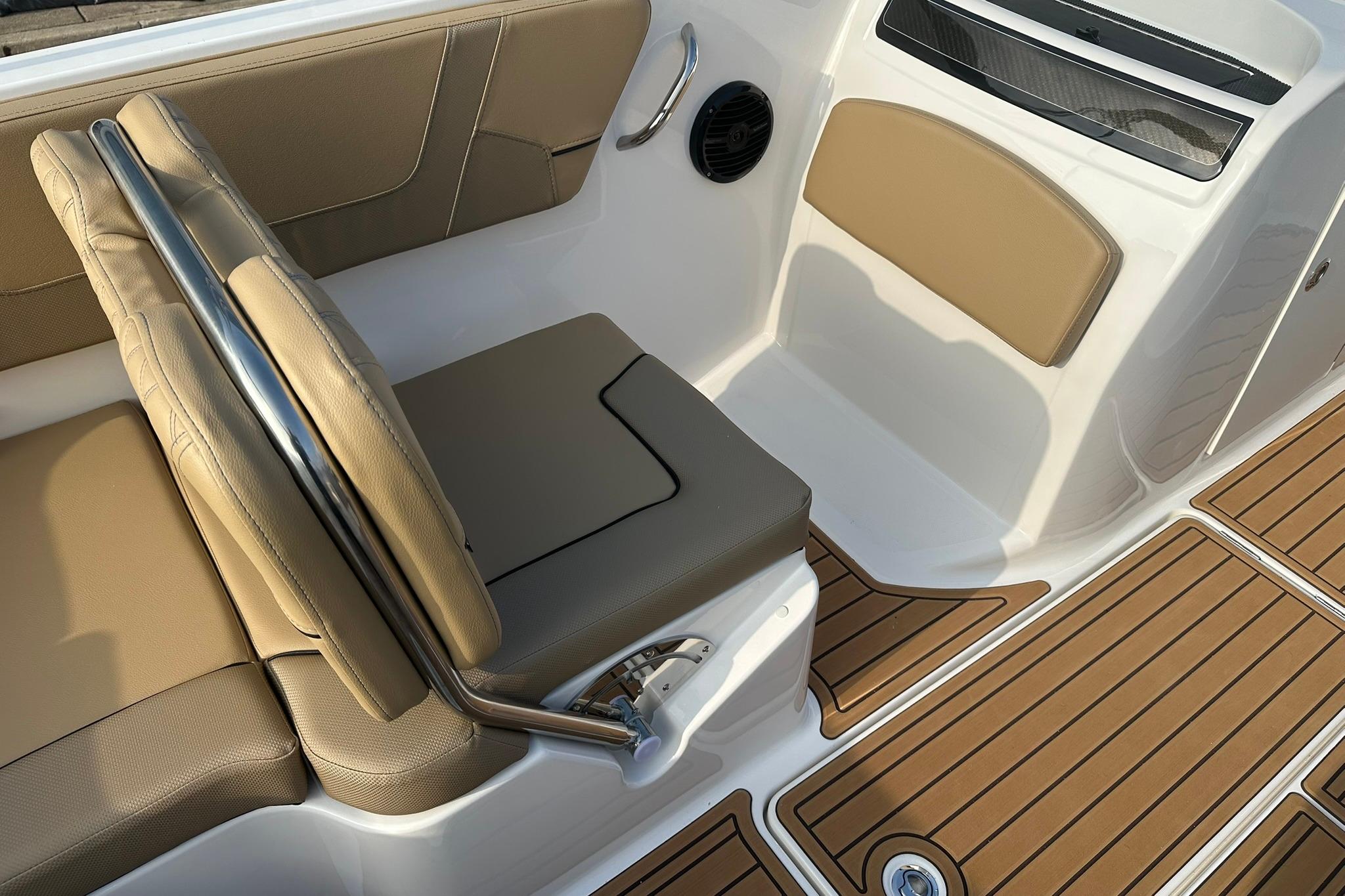 2026 Bayliner VR6 Bowrider OB interior with tan seating and teak-style flooring.