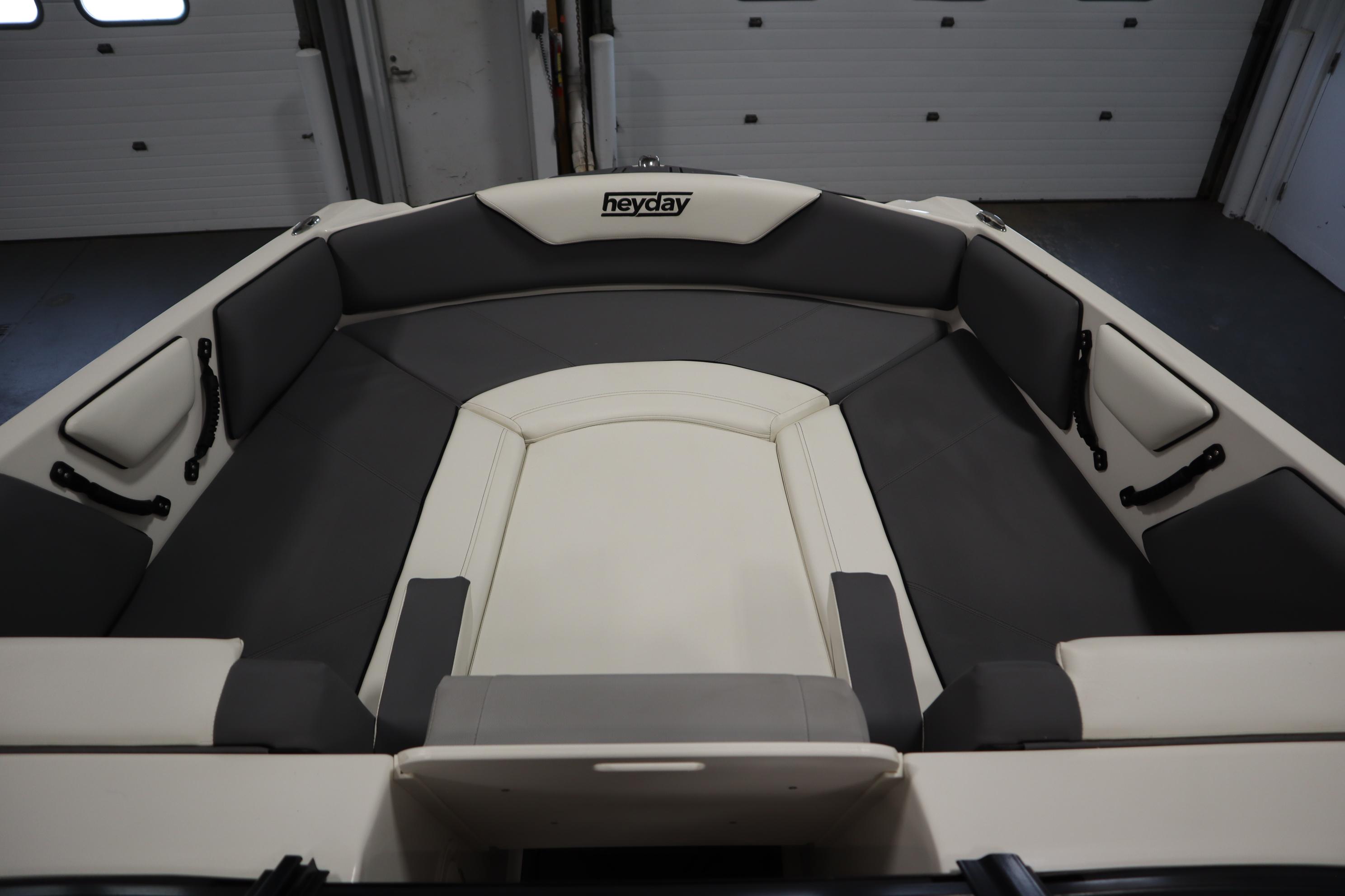 2023 Heyday WT Surf boat interior with gray and white seating.