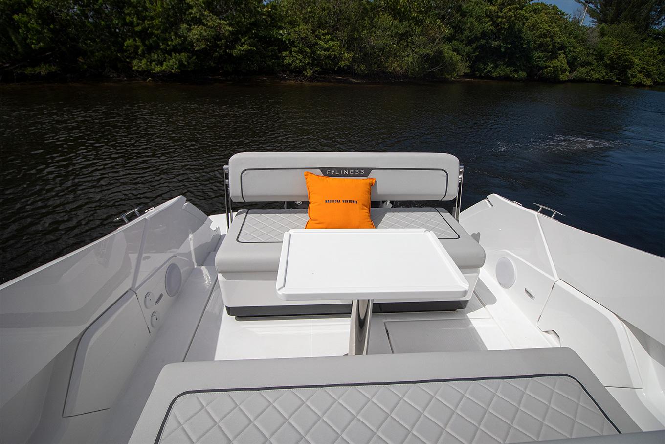 2021 Fairline F Line 33 boat interior with seating and table.